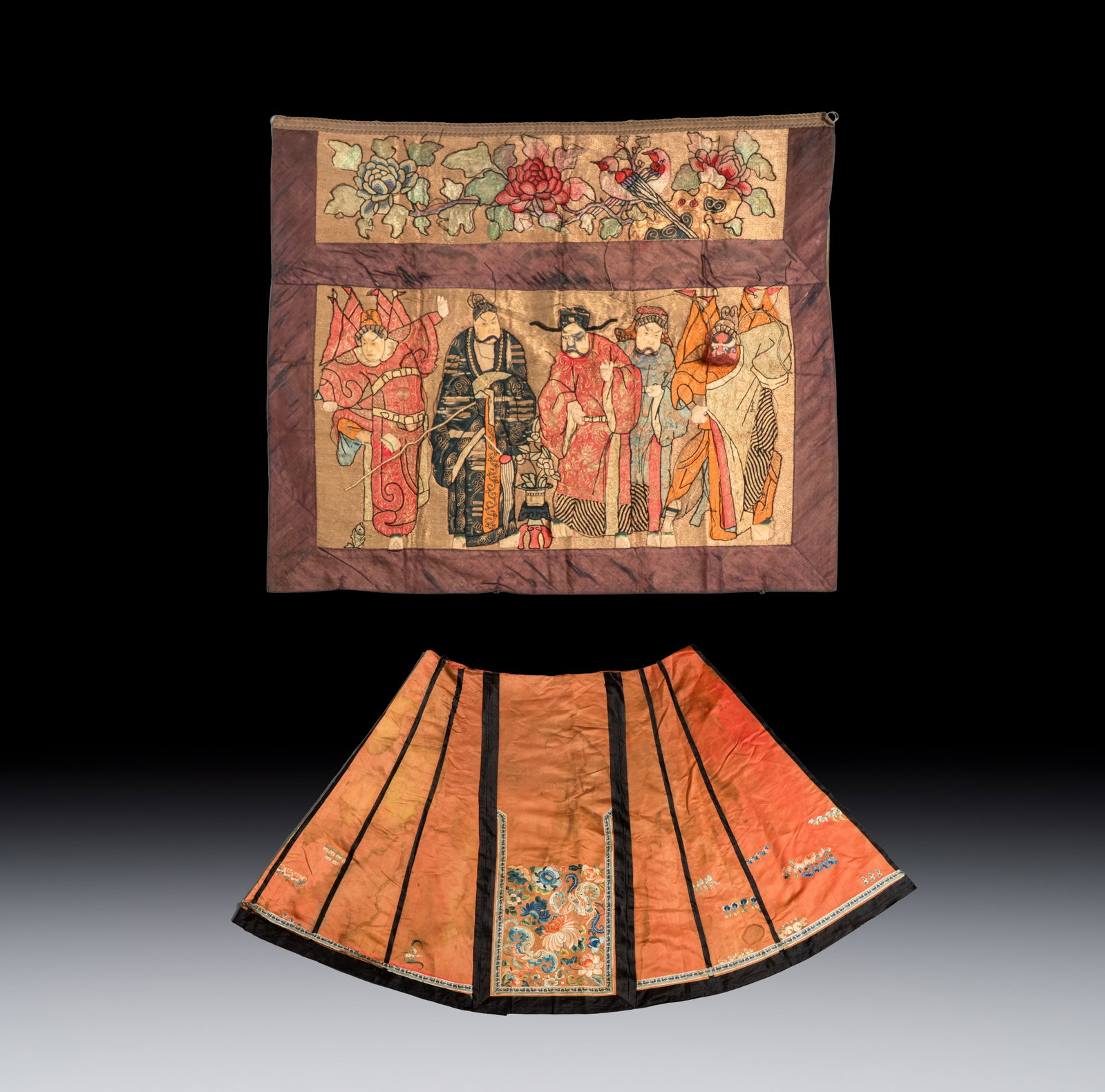 A Chinese embroidered silk 'Opera' panel and a salmon-ground skirt, 19th C. (1 of 5)