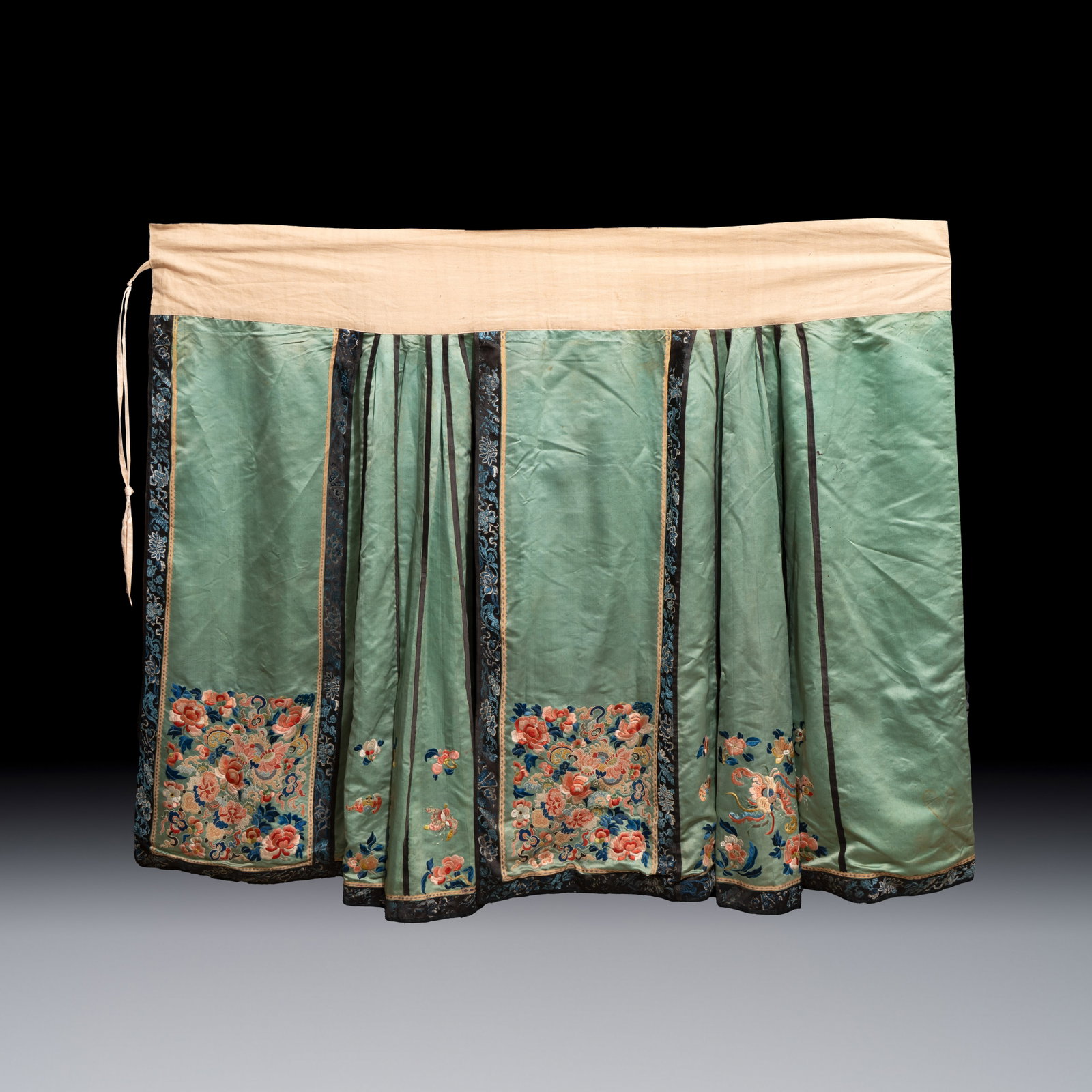 A Chinese embroidered silk green-ground skirt, 19th C.: A Chinese embroidered silk green-ground skirt, 19th C. Dim: 103 x 120 cm