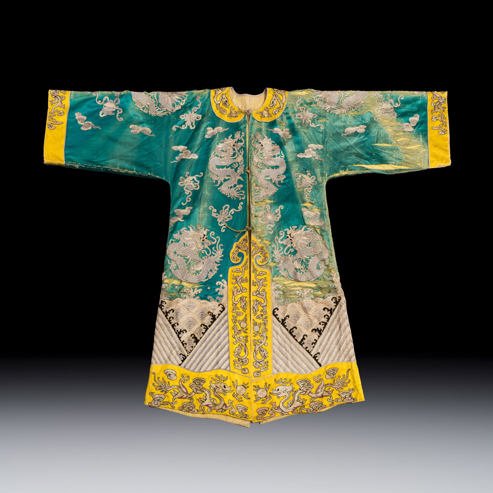 A Chinese peacock-green and yellow-ground silk embroidered 'Dragons' Peking opera robe, 20th C. (1 of 2)