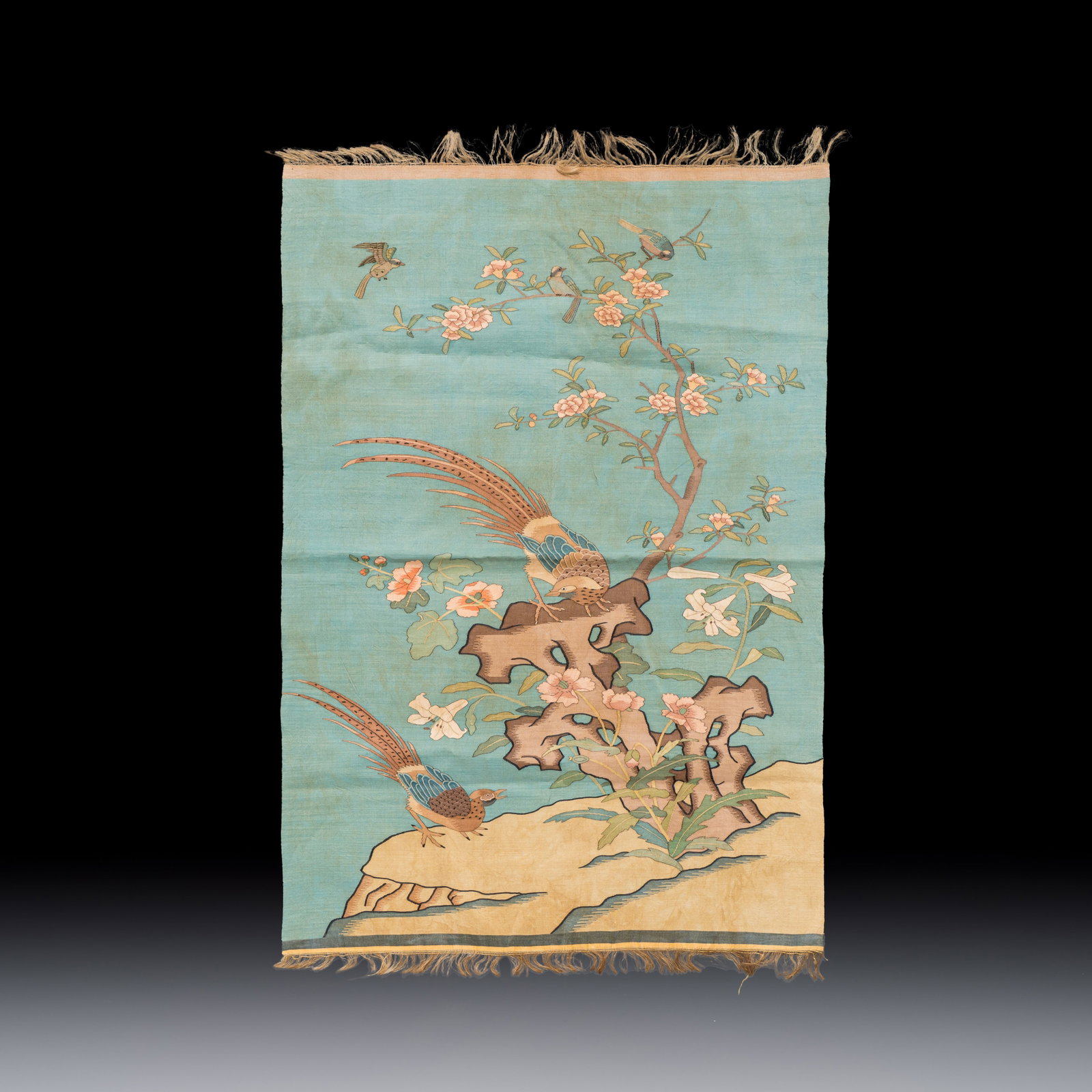 A Chinese kesi silk 'Pheasants Among Flowers and Rockwork' panel, 19/20th C. (1 of 2)
