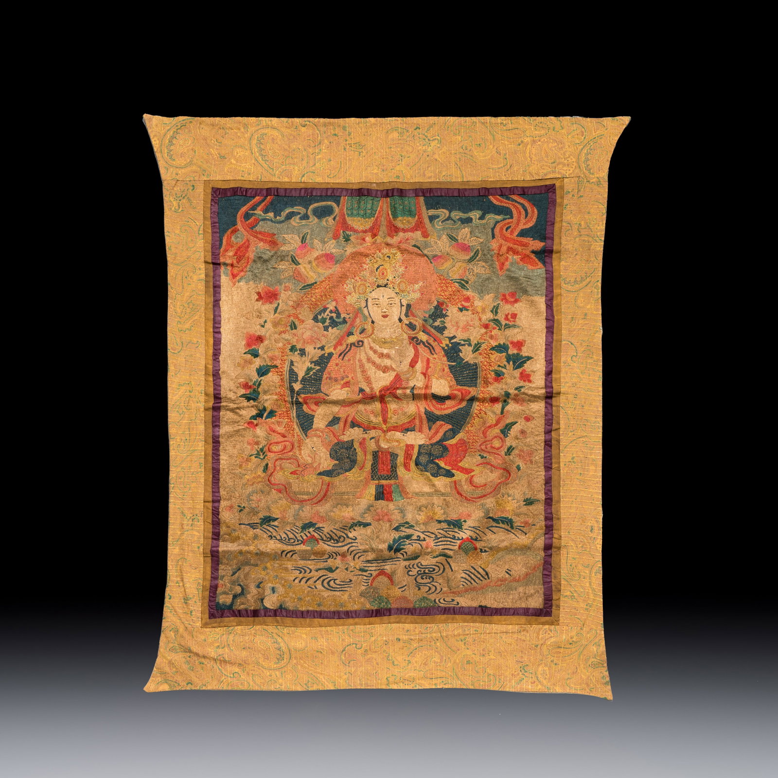 A Chinese silk and gold-thread embroidered 'White Tara' thangka, 19/20th C. (1 of 2)