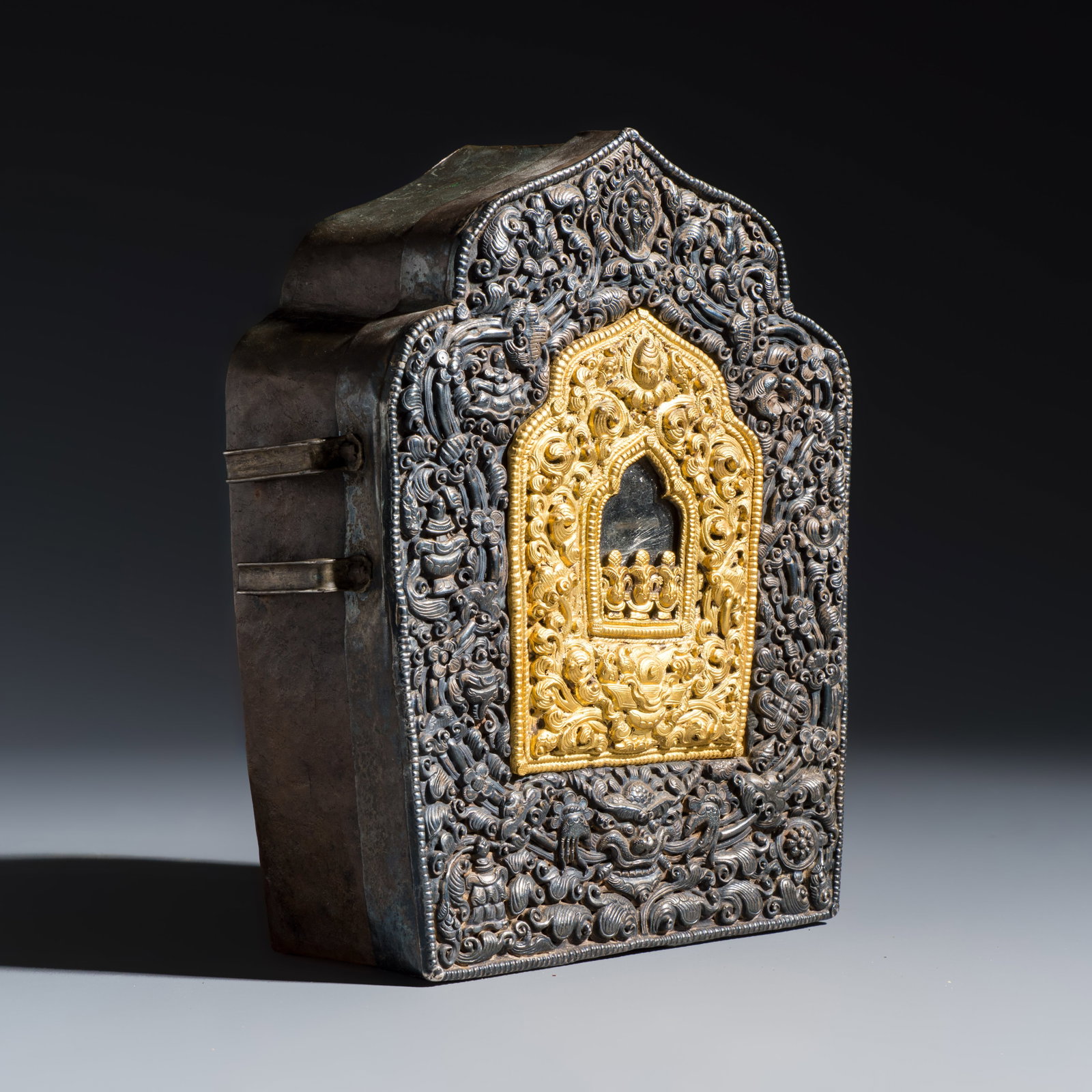 A Tibetan parcel-gilt silver and copper gau shrine box, 19/20th C. (1 of 9)