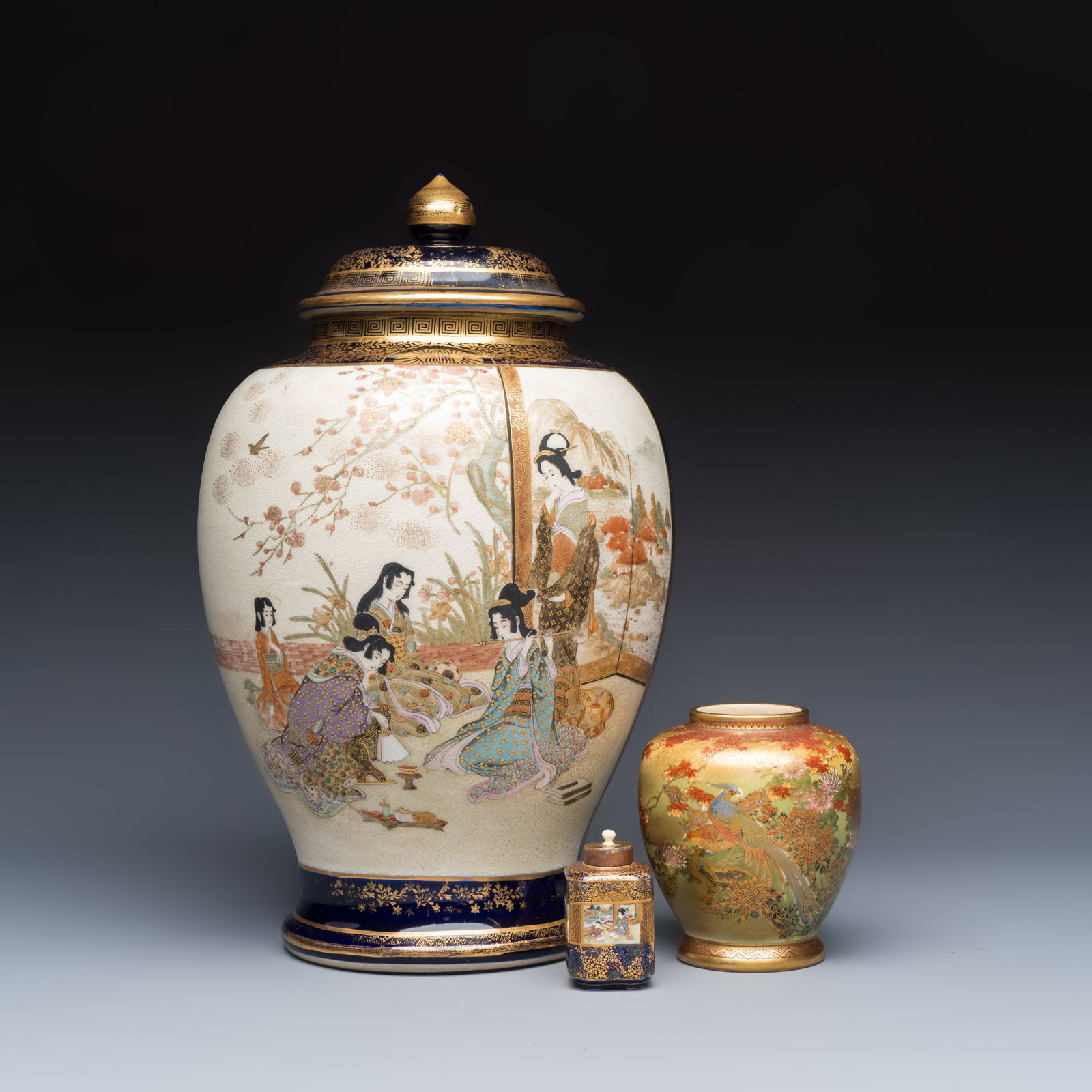 Two Japanese Satsuma vases and a tea caddy, one with Jinzan mark, Meiji, 19th C.: Two Japanese Satsuma vases and a tea caddy, one with Jinzan mark, Meiji, 19th C. H.: 37,5 cm | the largest, incl. cover H.: 6,8 cm | the smallest, incl. cover