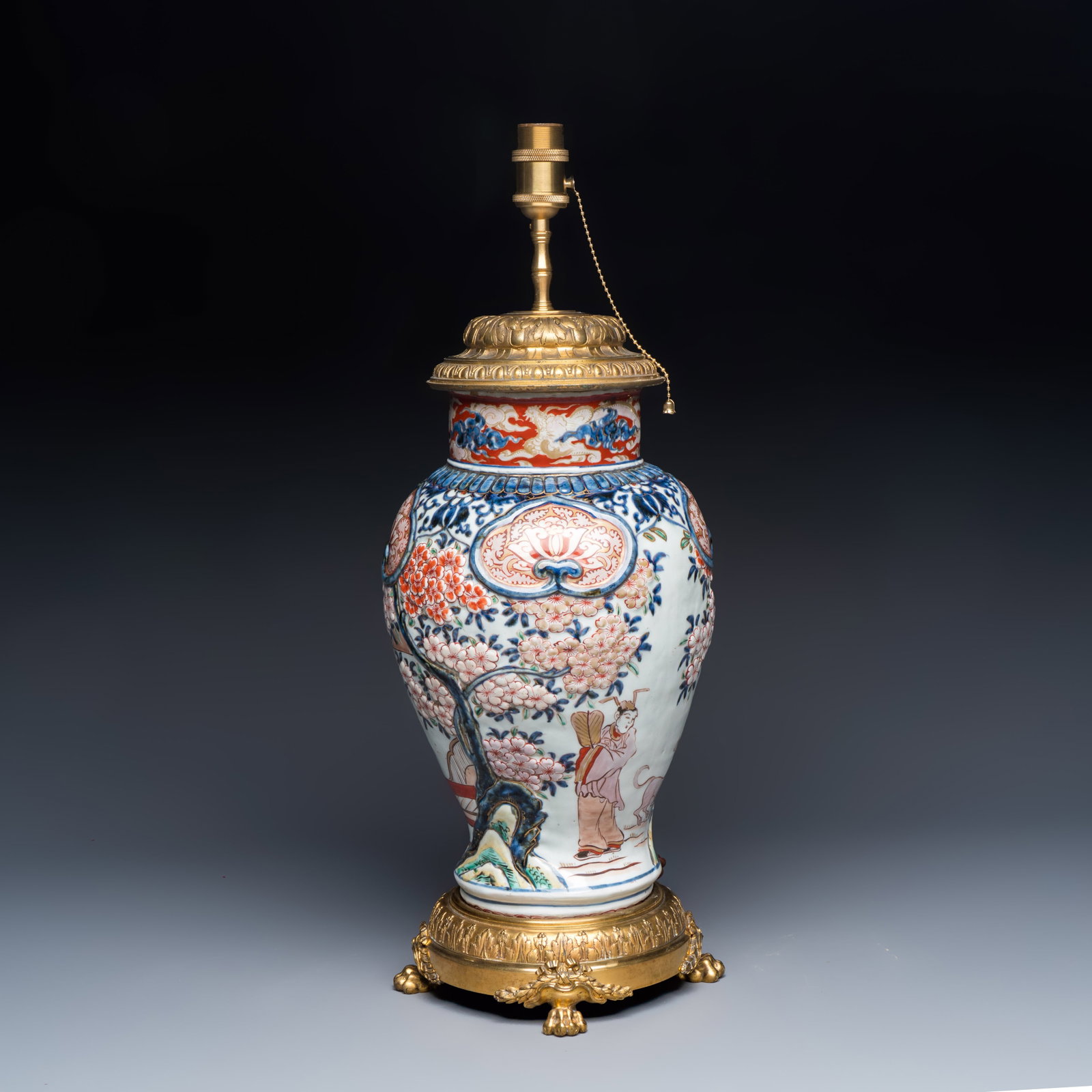 A Japanese Imari 'Figures and Flowering Branches' vase with applied design, mounted as a lamp, Edo, (1 of 6)