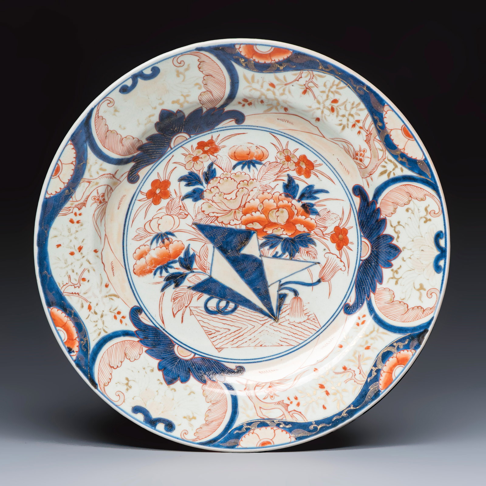 A Japanese Imari 'Origami and Flowers' dish, Edo, early 18th C. (1 of 2)