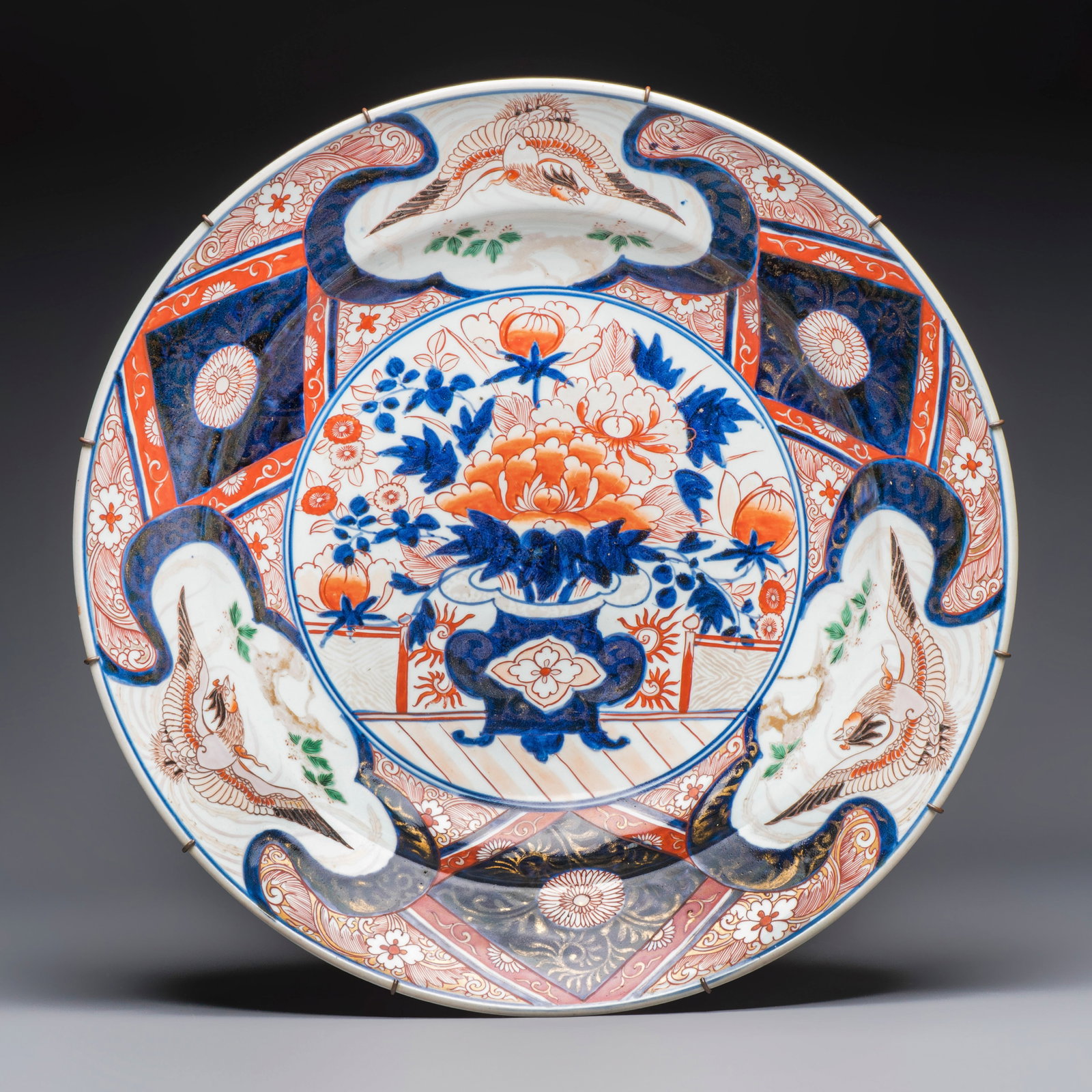 A very large Japanese Imari 'Phoenixes and Peonies' dish, Edo, 17/18th C. (1 of 2)
