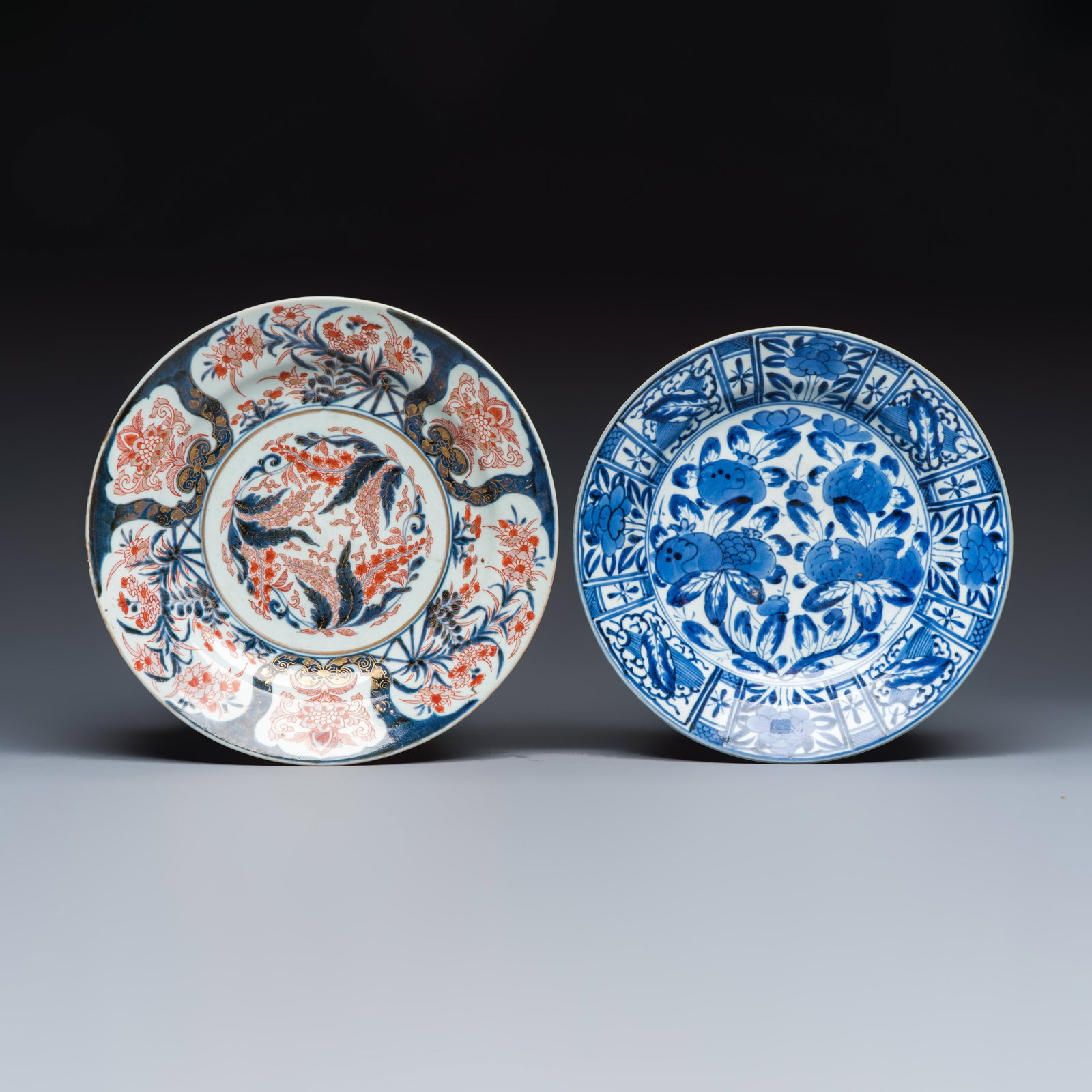 A Japanese blue and white dish and a Japanese Imari dish, Edo, 17th C. (1 of 2)