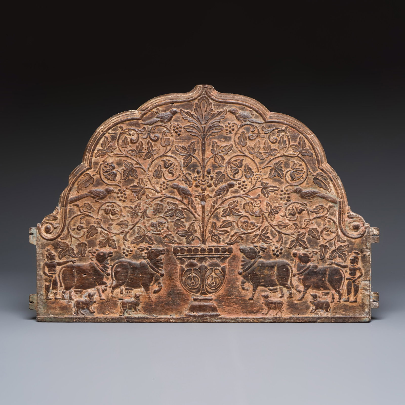 A carved wooden panel with animals and figures among a fruiting tree, Possibly India, 19th C.: A carved wooden panel with animals and figures among a fruiting tree, Possibly India, 19th C. L.: 71,5 cm - H.: 48 cm