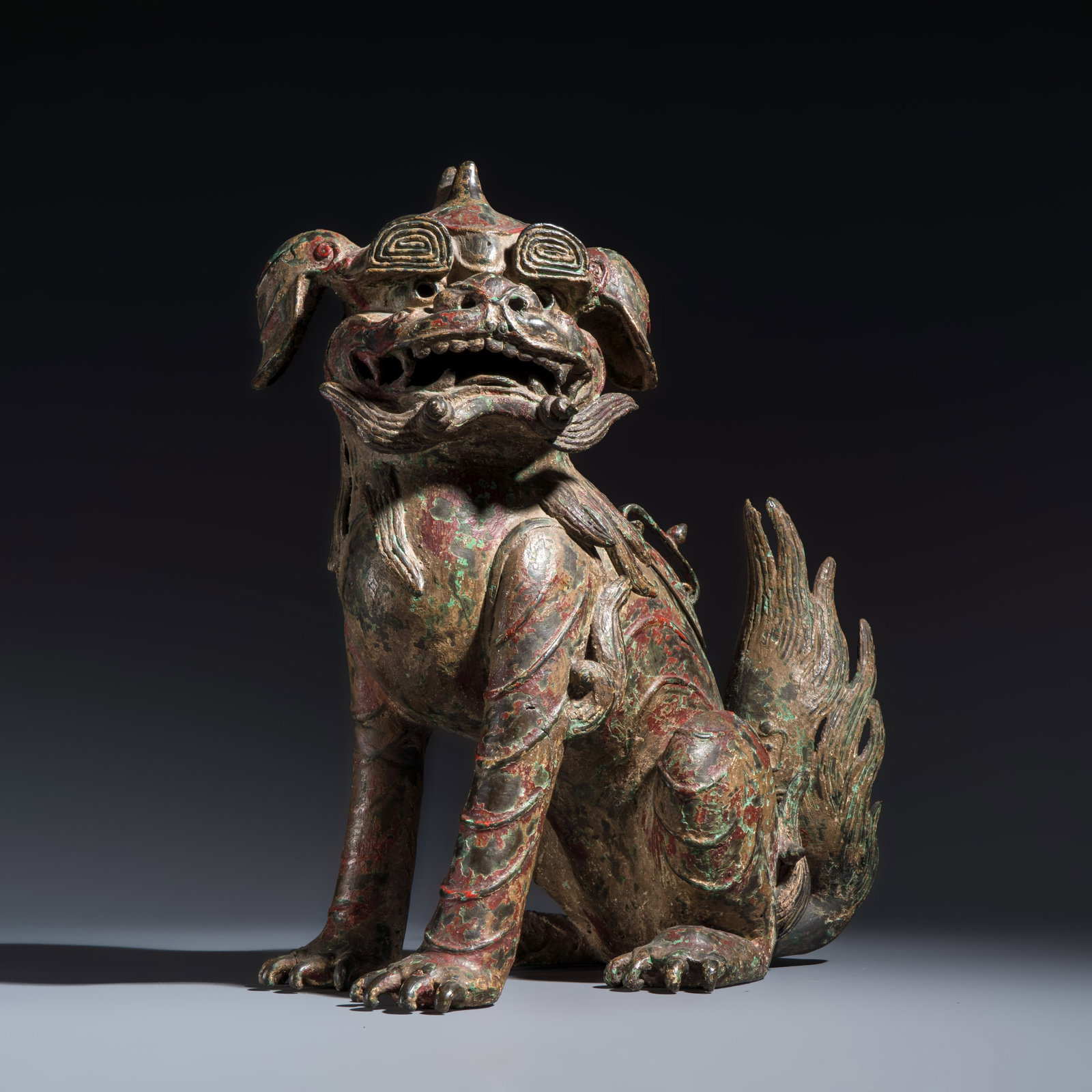 A large Chinese polychromed bronze Buddhist lion-form incense burner, probably Ming: A large Chinese polychromed bronze Buddhist lion-form incense burner, probably Ming Dim: 42,5 x 36 x 22 cm Weight: 7,2 kilograms