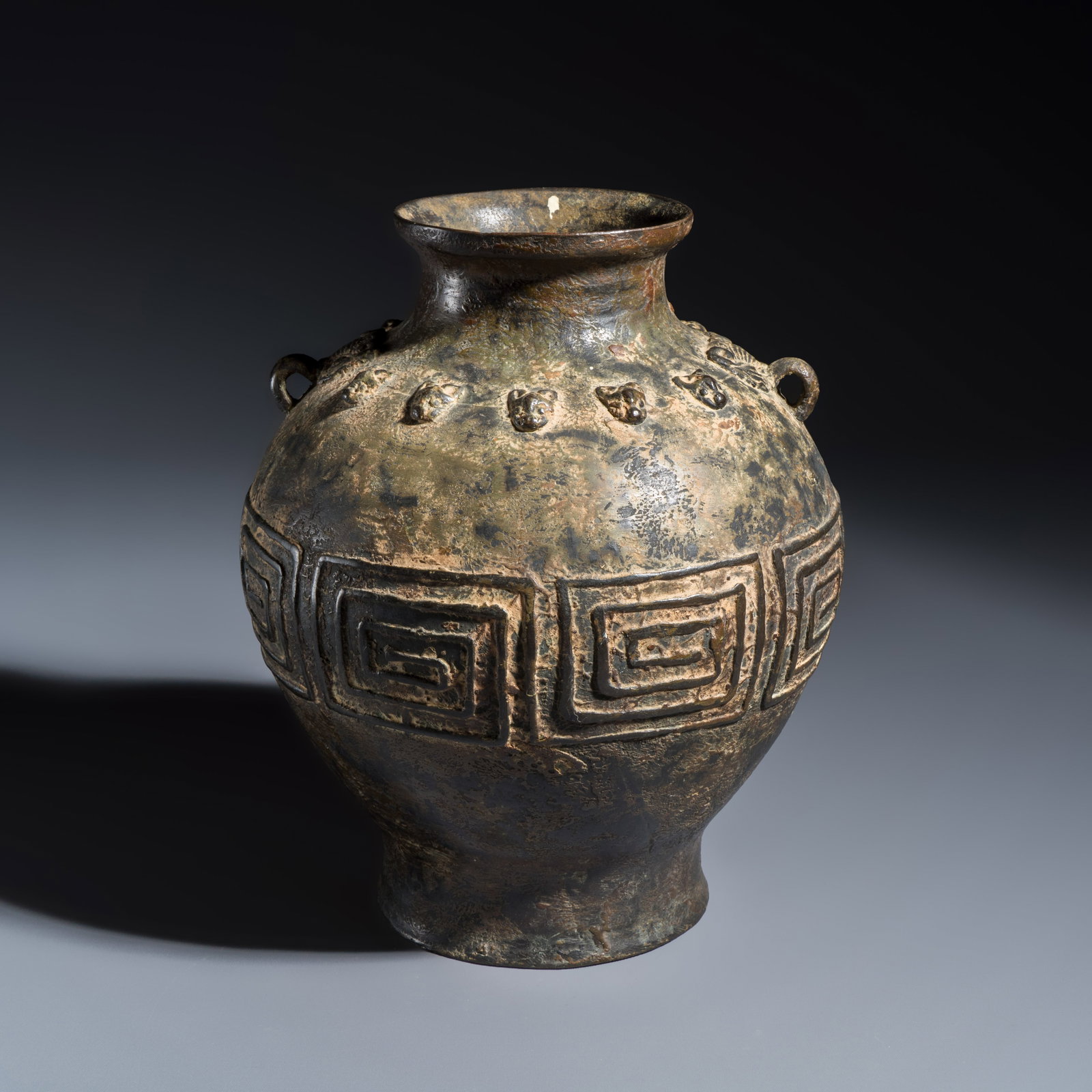 A Chinese archaistic bronze vase with taotie handles, Qing or earlier: A Chinese archaistic bronze vase with taotie handles, Qing or earlier H.: 23,9 cm Weight: 1869 grams