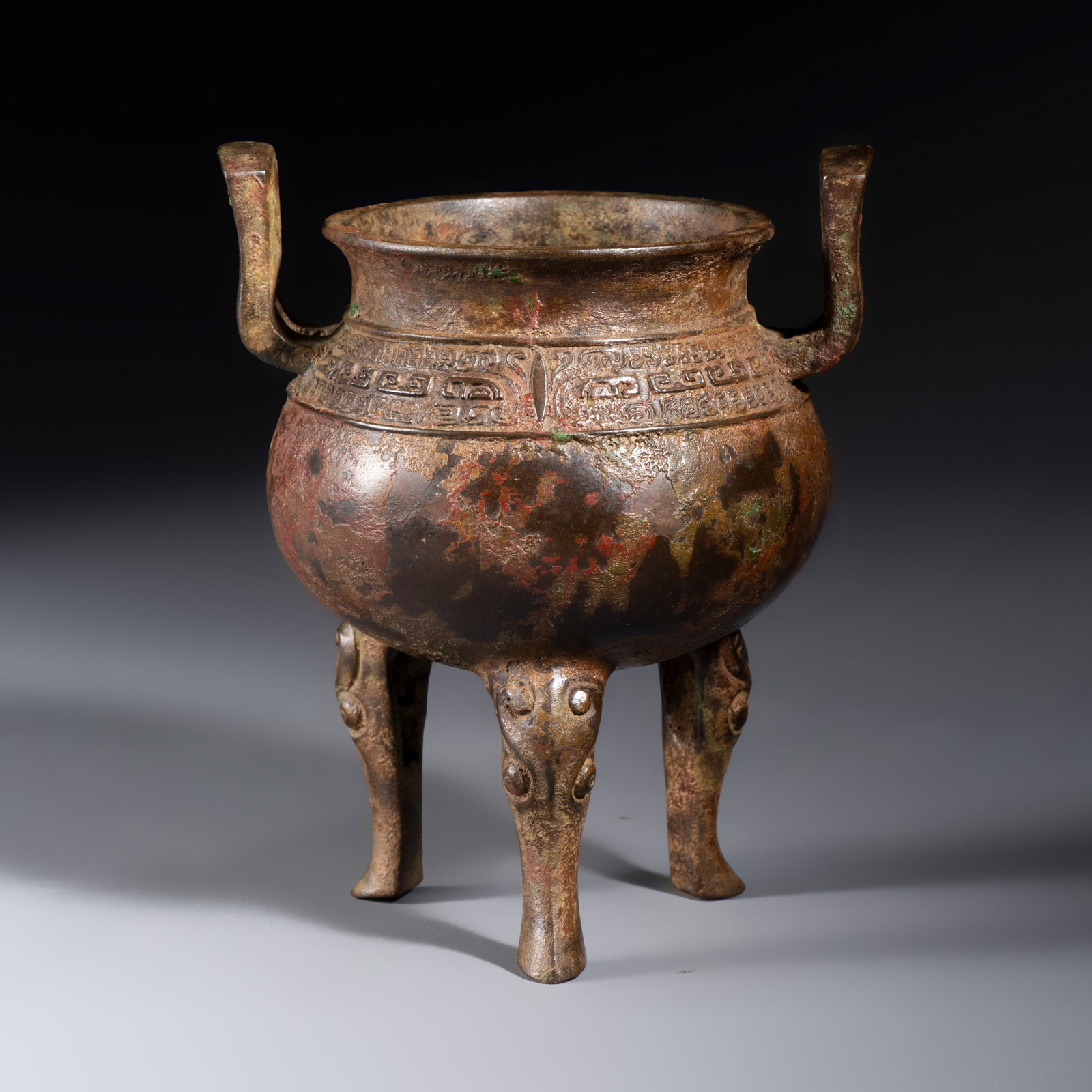 A Chinese bronze ding-form tripod censer with handles, Ming (1 of 7)