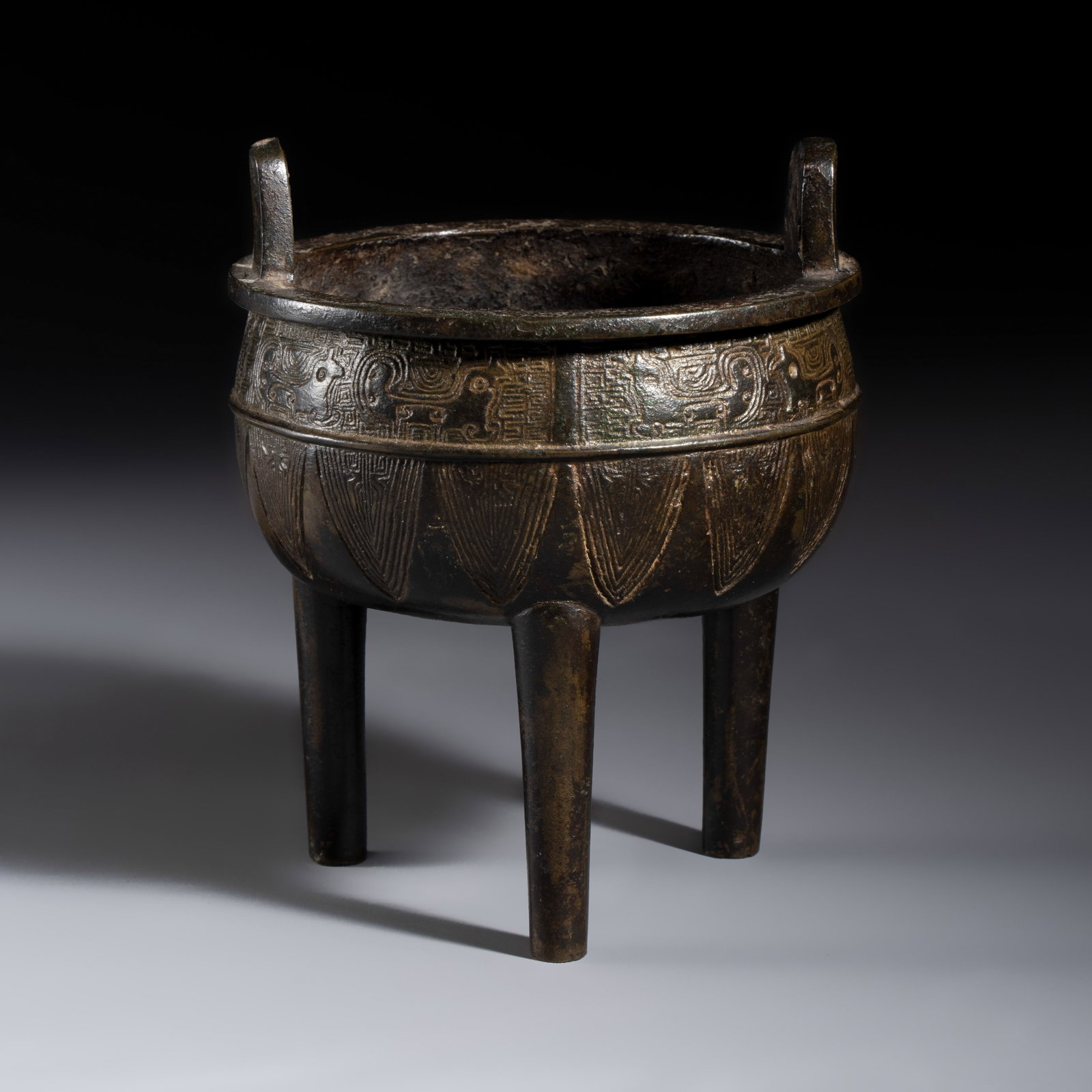 A Chinese archaistic bronze ding-form tripod censer, Yuan/Ming (1 of 7)