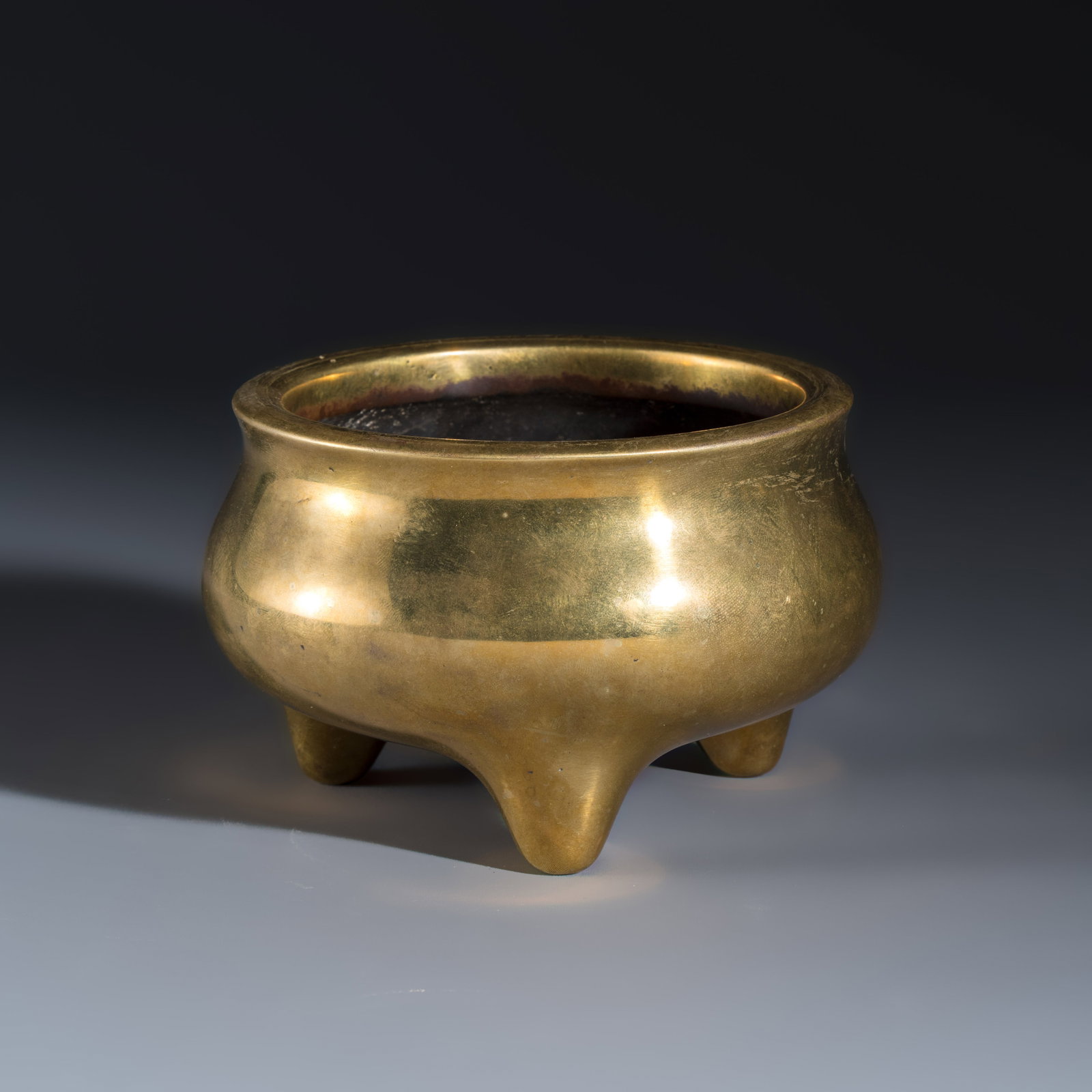 A Chinese bronze tripod censer, Xuande mark, 17/18th C. (1 of 7)