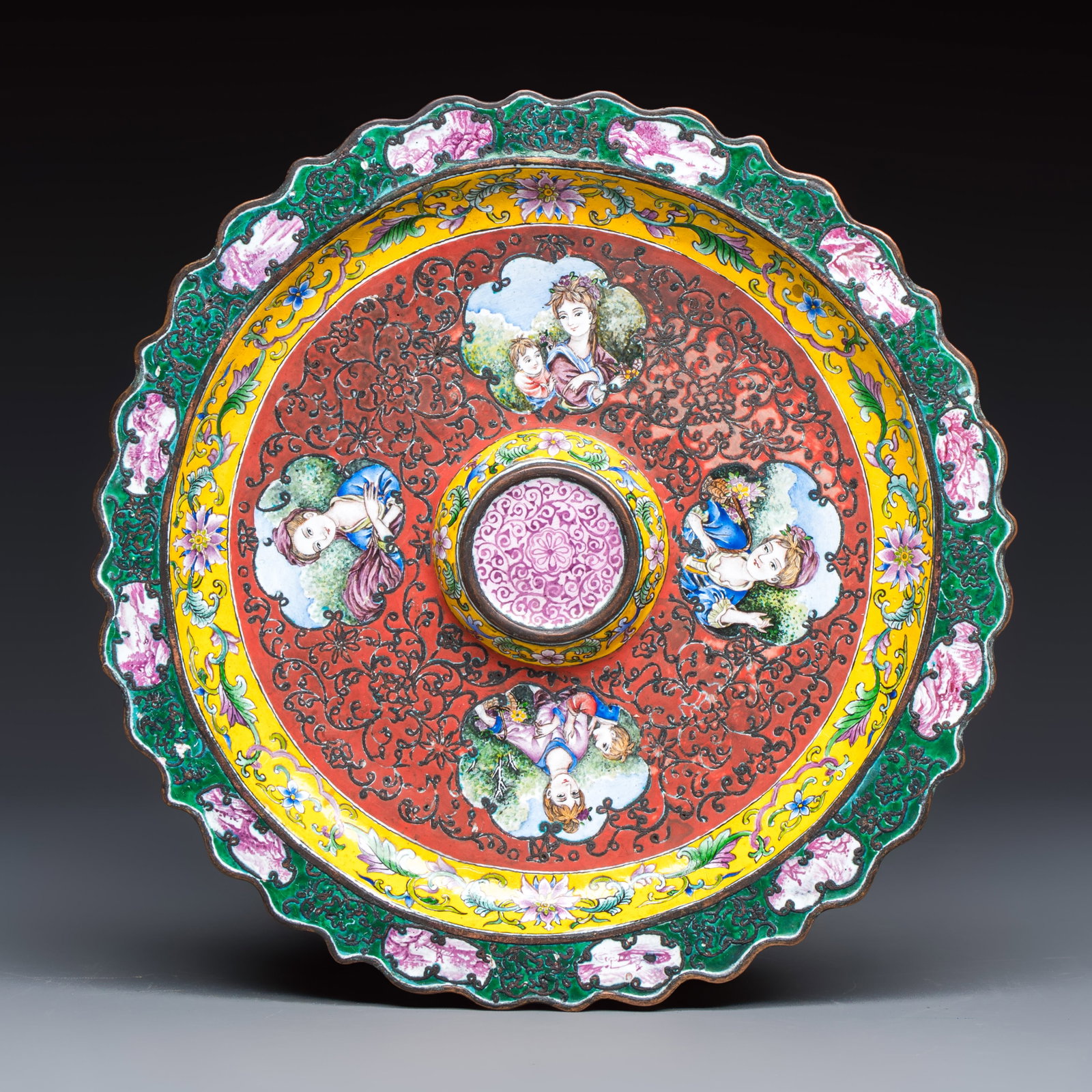 A Chinese enamel 'European Subject' saucer dish, Qianlong mark, 20th C.: A Chinese enamel 'European Subject' saucer dish, Qianlong mark, 20th C. Dia.: 18,3 cm