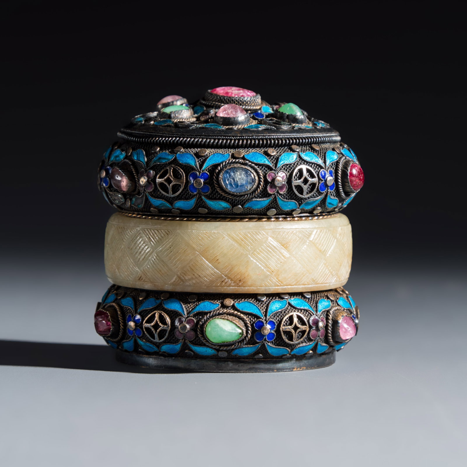 A Chinese enamelled silver box and cover, inset with jade and precious stones, 20th C. (1 of 8)