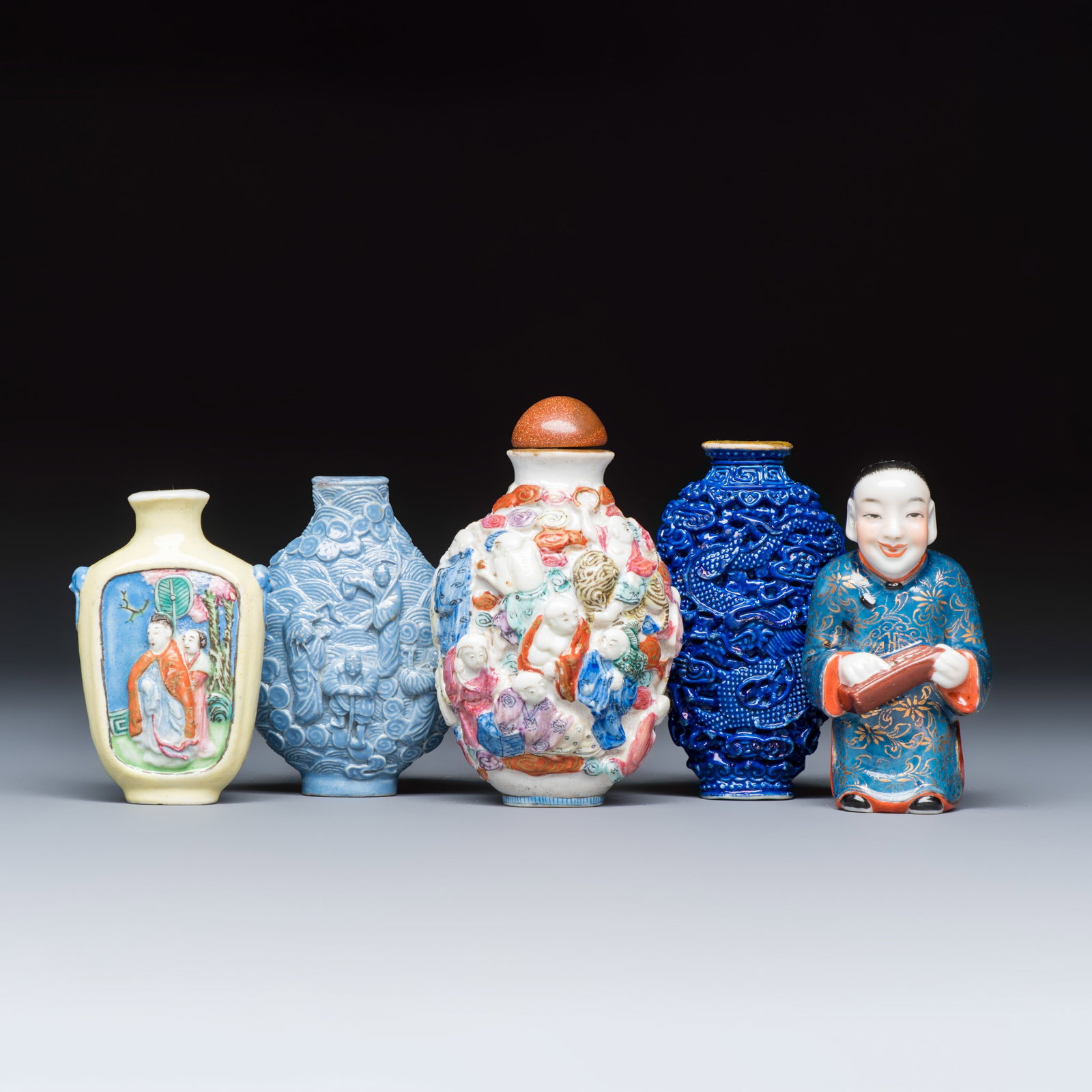 Five Chinese relief-moulded snuff bottles, Qianlong marks, 19/20th C. (1 of 7)