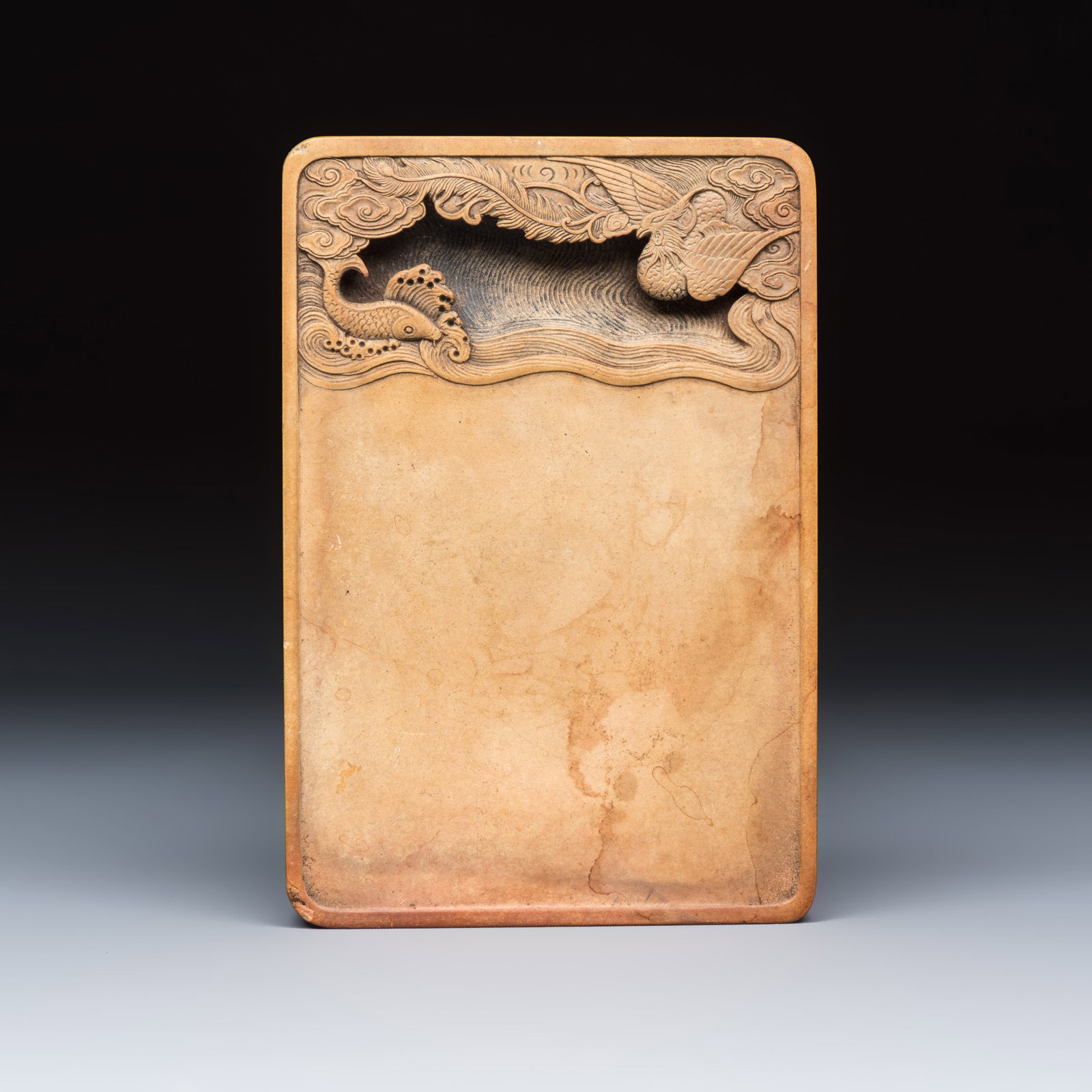 A Chinese 'Phoenix and Carp' ink stone, Qianlong mark and possibly of the period (1 of 3)