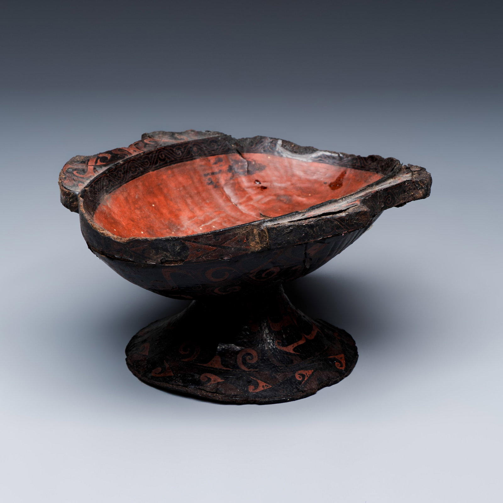 A Chinese lacquered stem cup with two handles, Warring States period: A Chinese lacquered stem cup with two handles, Warring States period Dim: 17,5 x 14,7 x 9 cm