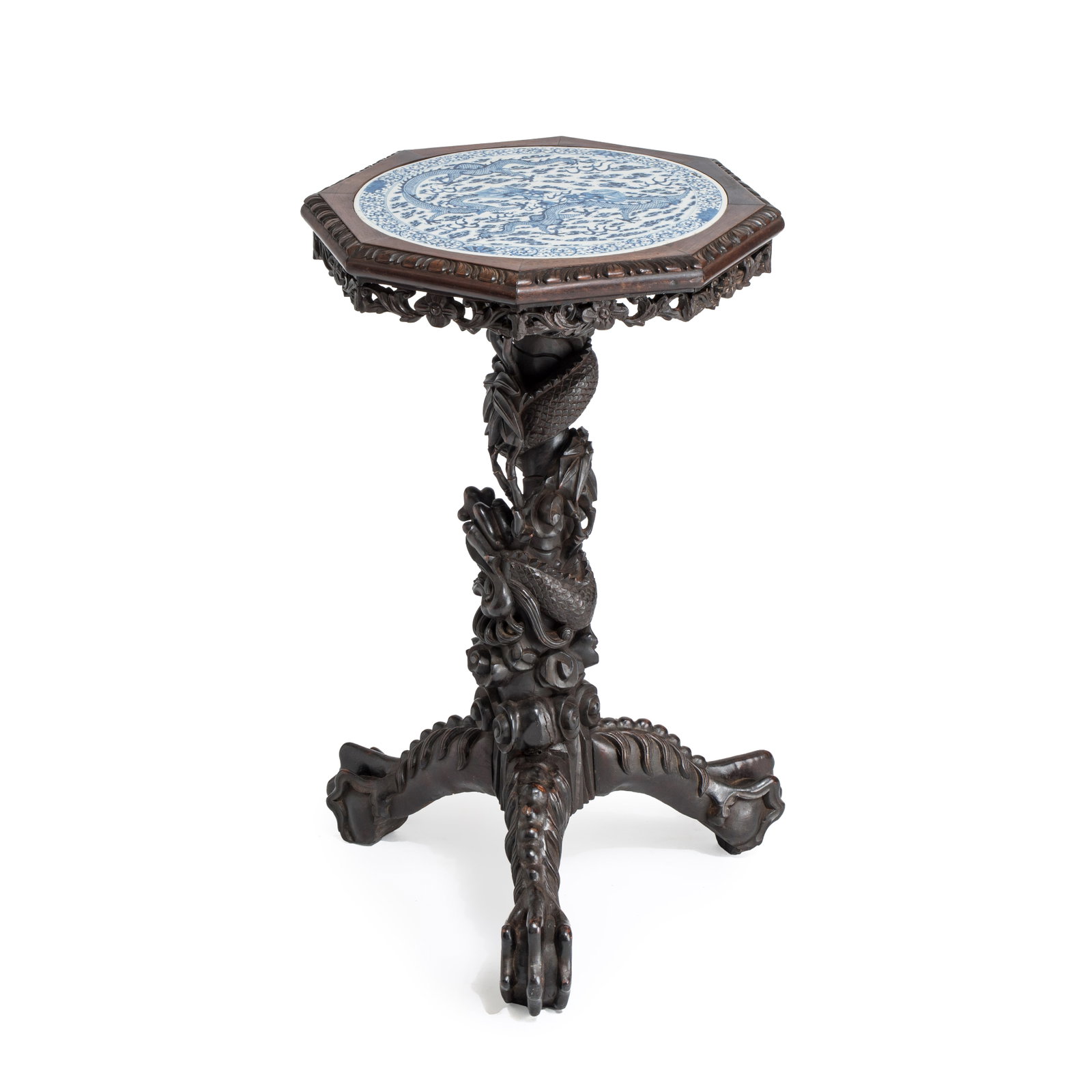 A Chinese carved hongmu table with a blue and white 'Dragons' plaque, 19th C. (1 of 7)