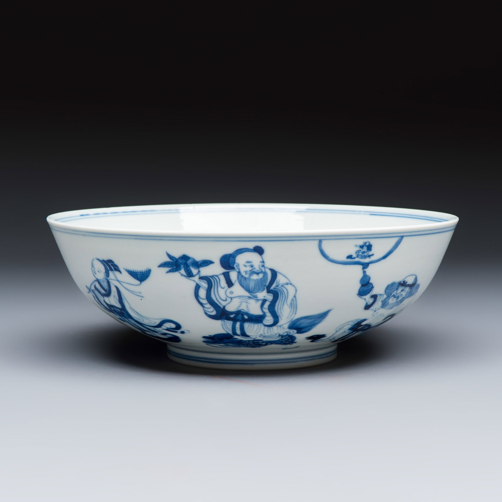 A Chinese blue and white 'Ba Xian Zhu Shou' bowl, Guangxu mark and of the period (1 of 7)