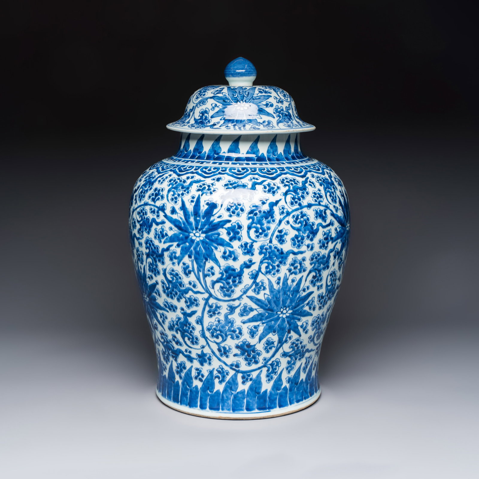 A large Chinese blue and white 'Lotus Scroll' vase and cover, Kangxi: A large Chinese blue and white 'Lotus Scroll' vase and cover, Kangxi H.: 60 cm | incl. cover
