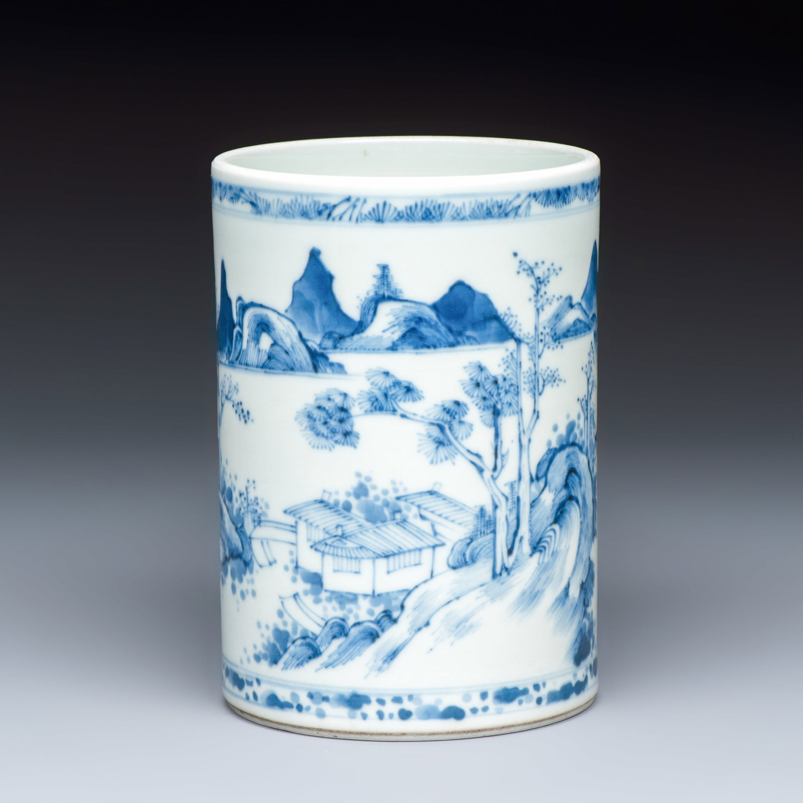 A fine Chinese blue and white 'Mountainous Riverscape' brush pot, Kangxi (1 of 7)