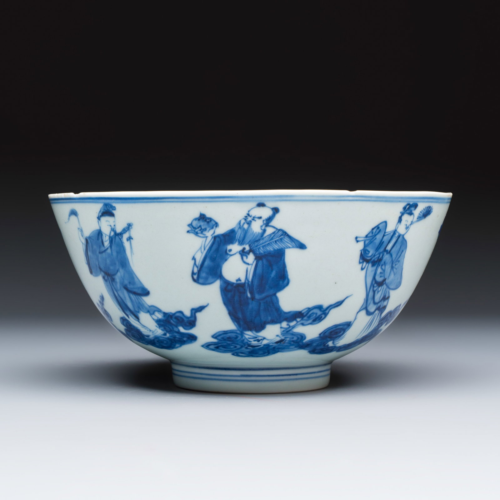 A Chinese blue and white 'Eight Immortals' bowl, Qianlong mark and of the period: A Chinese blue and white 'Eight Immortals' bowl, Qianlong mark and of the period Dia.: 20,5 cm - H.: 9,7 cm