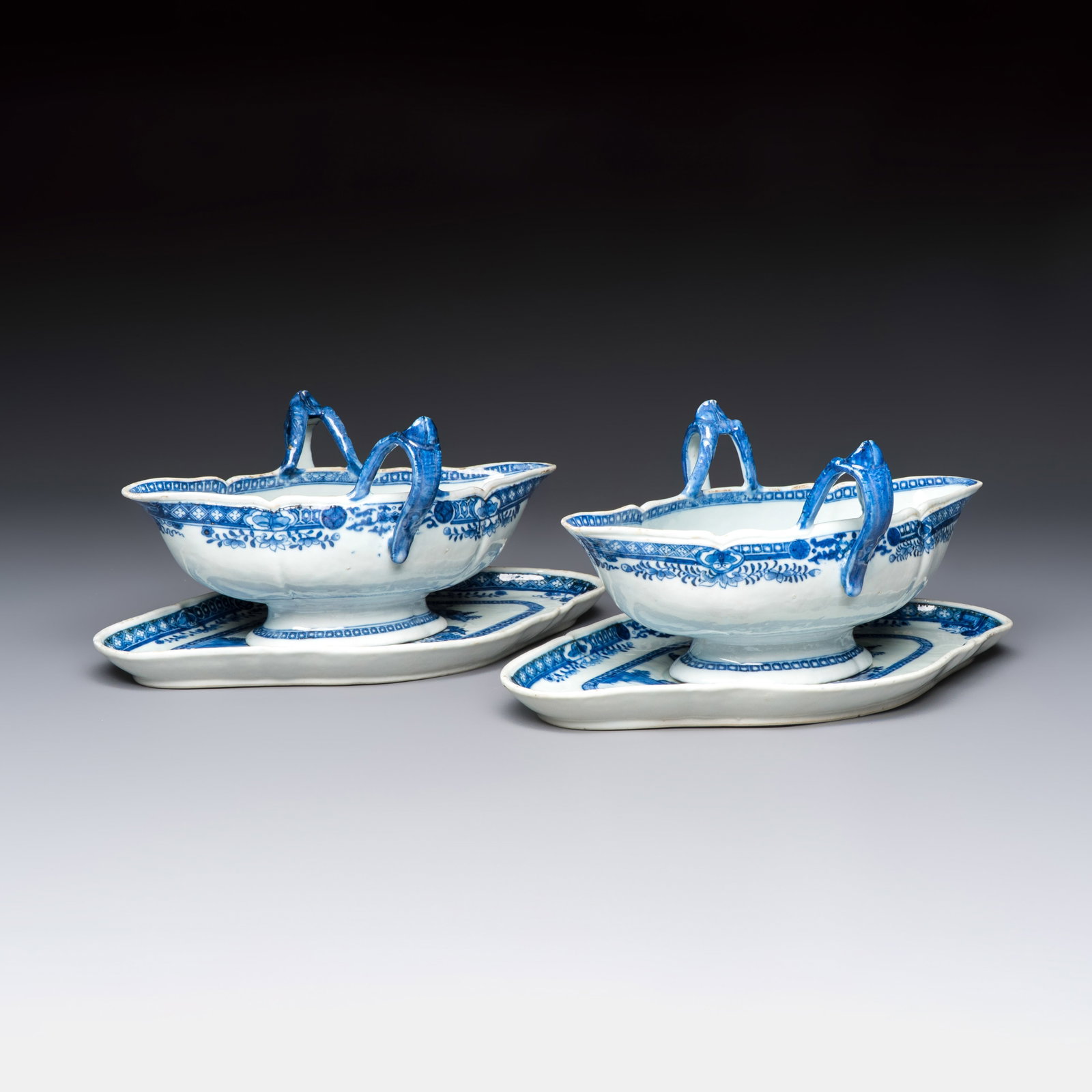A pair of Chinese blue and white handled sauce boats and stands with pagodas along a river, Qianlong (1 of 10)