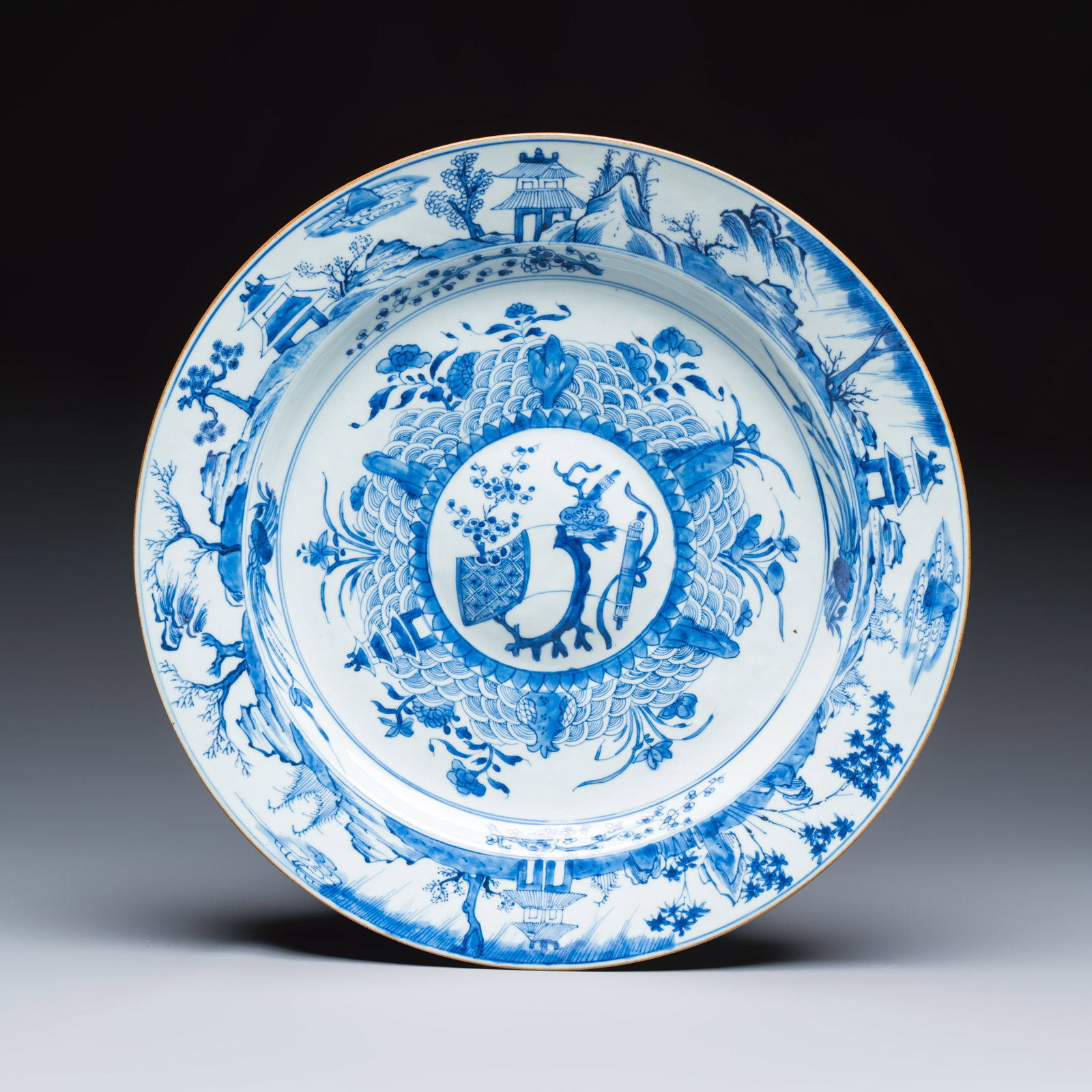 A Chinese blue and white dish with a raised medallion centre, Yongzheng (1 of 2)
