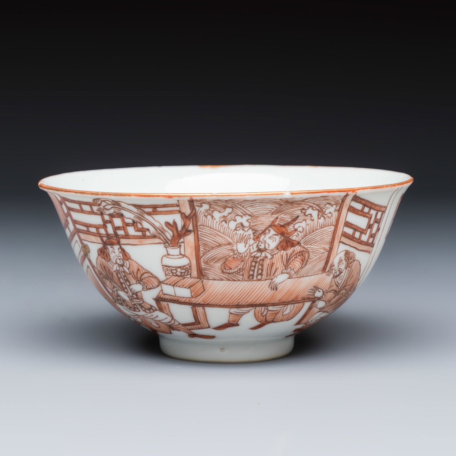 A Chinese iron-red-decorated bowl with narrative design, Qianlong/Jiaqing (1 of 7)