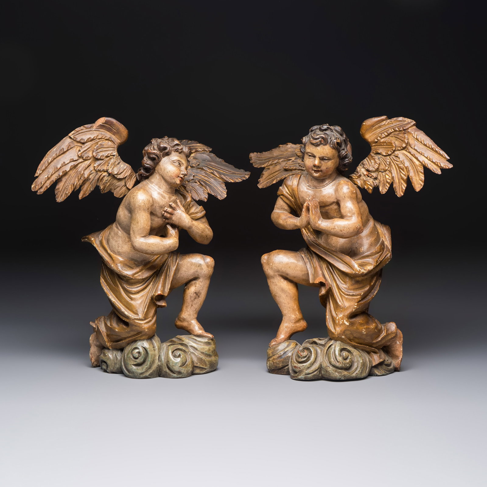 A pair of carved and gilt-polychromed wooden winged angels, Flanders or Spain, 17/18th C. (1 of 7)