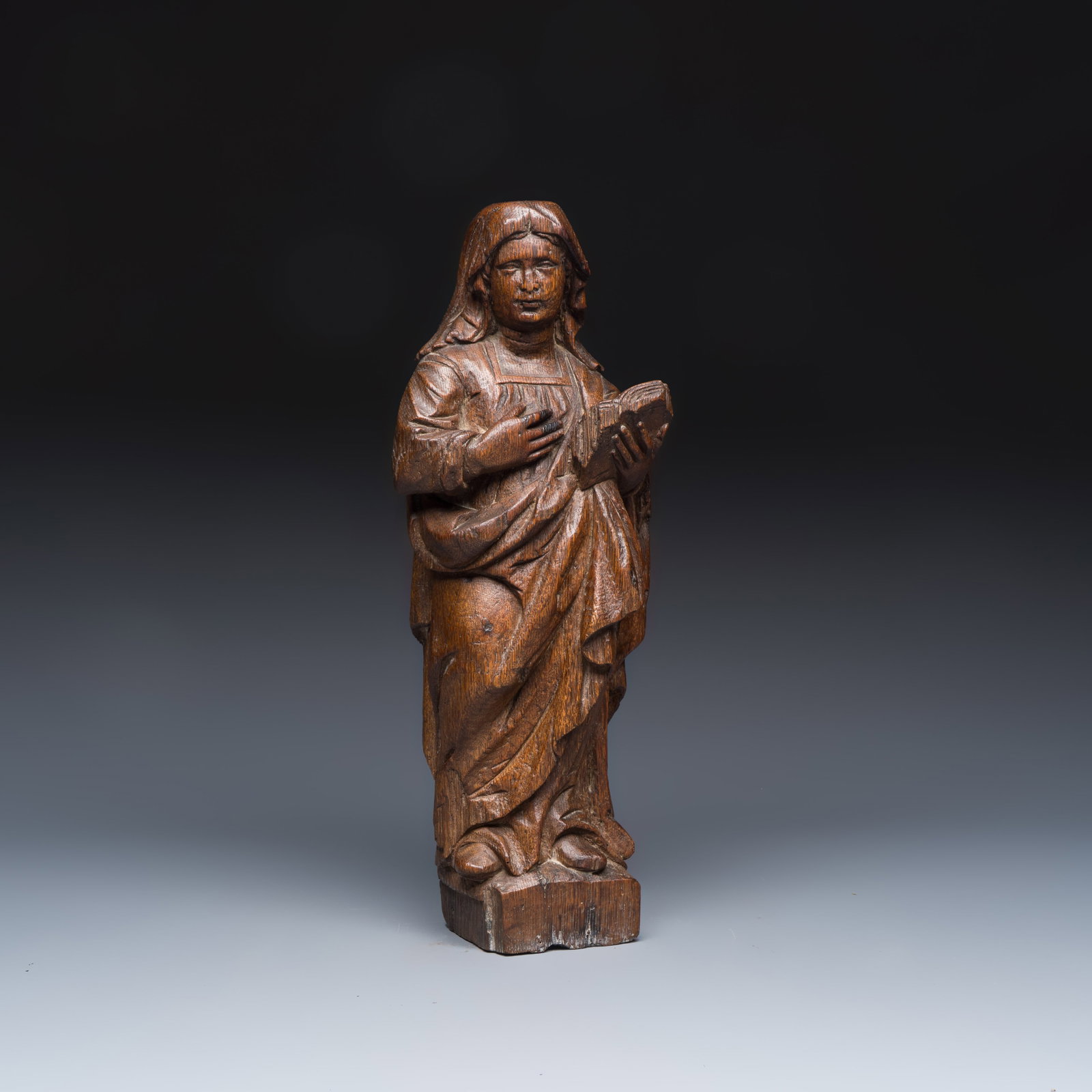 A French carved oak 'Virgin Mary at the Annunciation' figure, 16th C. (1 of 7)