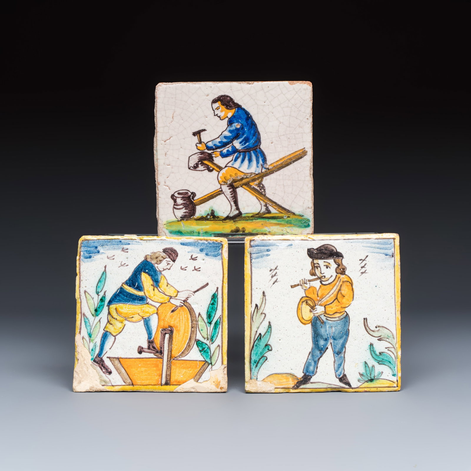 Three polychrome Catalan pottery tiles from the 'Arts and Crafts' series, Spain, 18/19th C. (1 of 7)