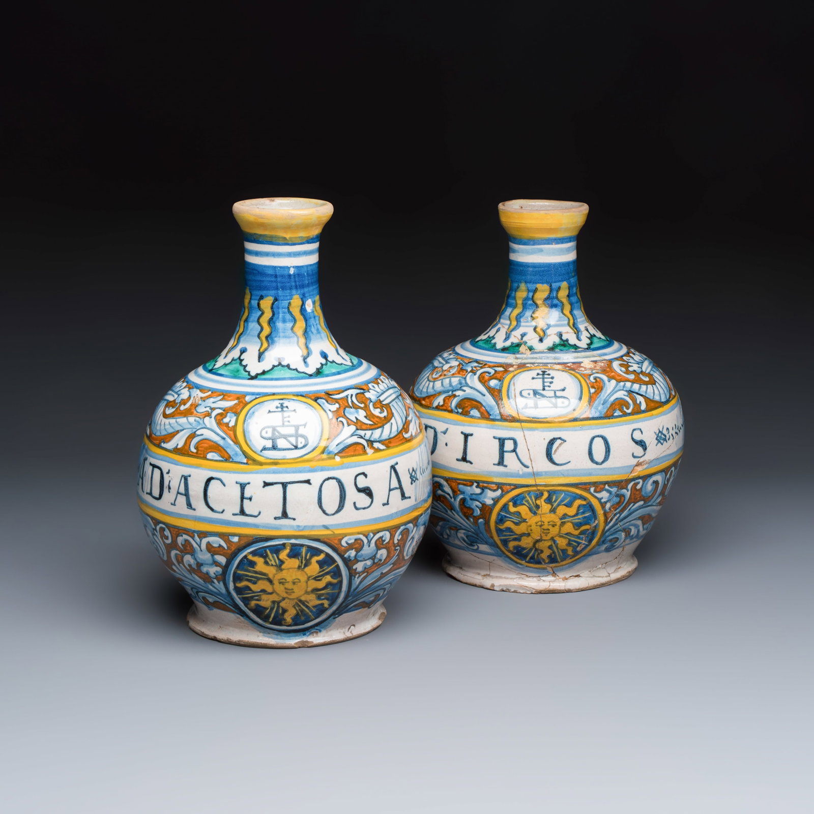 A pair of polychrome monogrammed Italian maiolica pharmacy bottles, probably workshop of Giacomo (1 of 7)