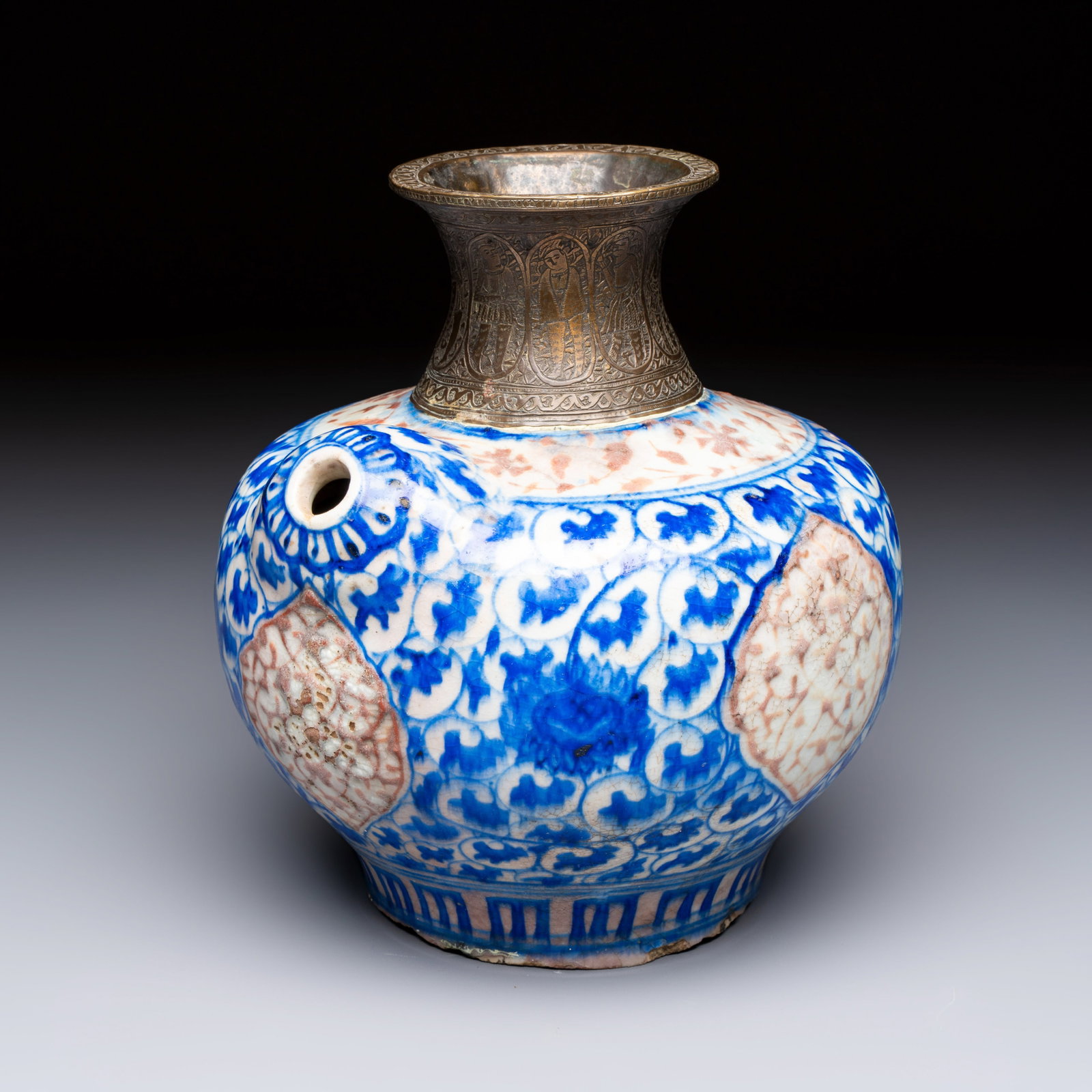 A Safavid blue, white and red pottery hookah base or kendi, Kirman, Persia, 17th C.: A Safavid blue, white and red pottery hookah base or kendi, Kirman, Persia, 17th C. H.: 21 cm