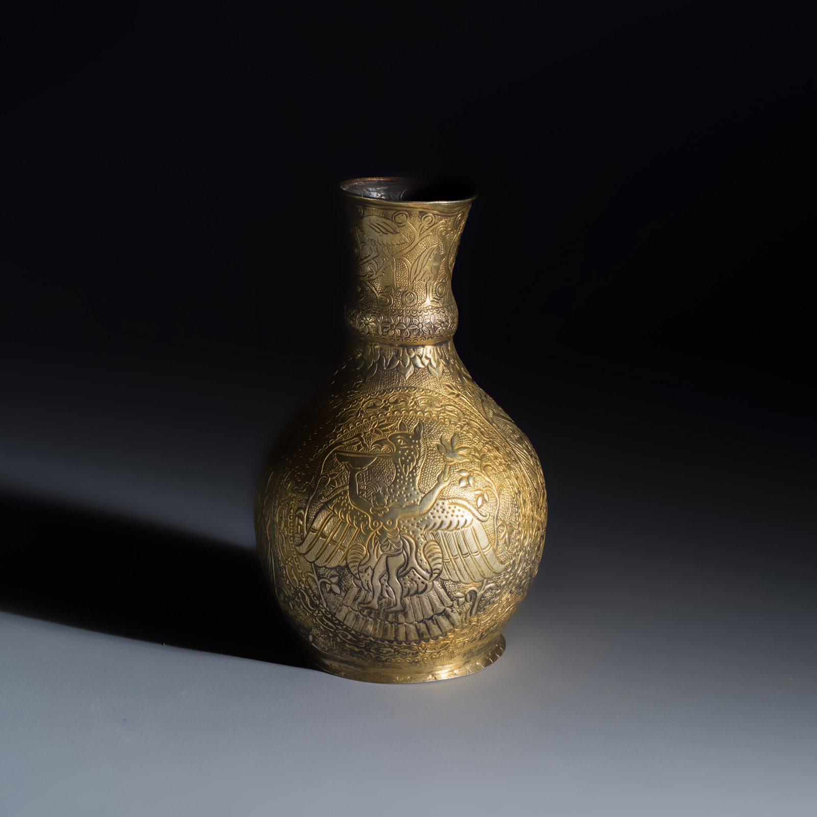 A gilt-silver repousse vase, probably Hungary, 19th C.: A gilt-silver repousse vase, probably Hungary, 19th C. H.: 16,4 cm Weight: 190 grams Ref.: The Met Museum, New York, Object Number: 85.12.8, for a similar example. The Met Museum, New York, Object Num