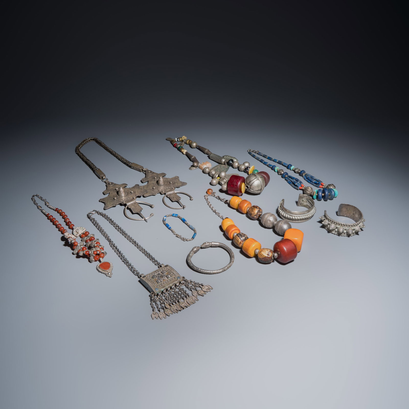 A collection of ten silver, metal, hardstone and bead-set jewellery, Asia and Africa, 19/20th C. (1 of 15)