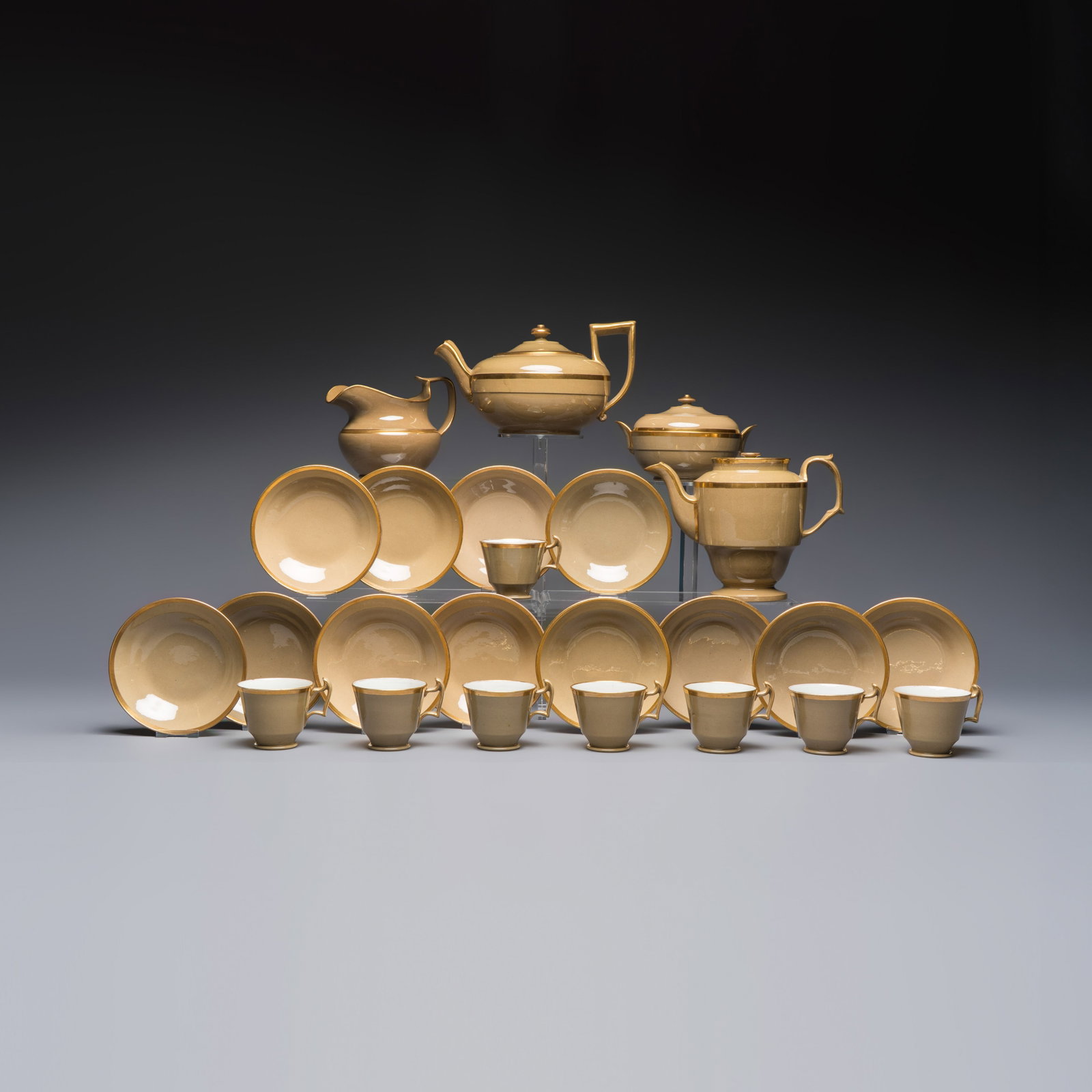 An English Spode mocha-ground and gilt 24-piece coffee and tea service, 19th C. (1 of 20)
