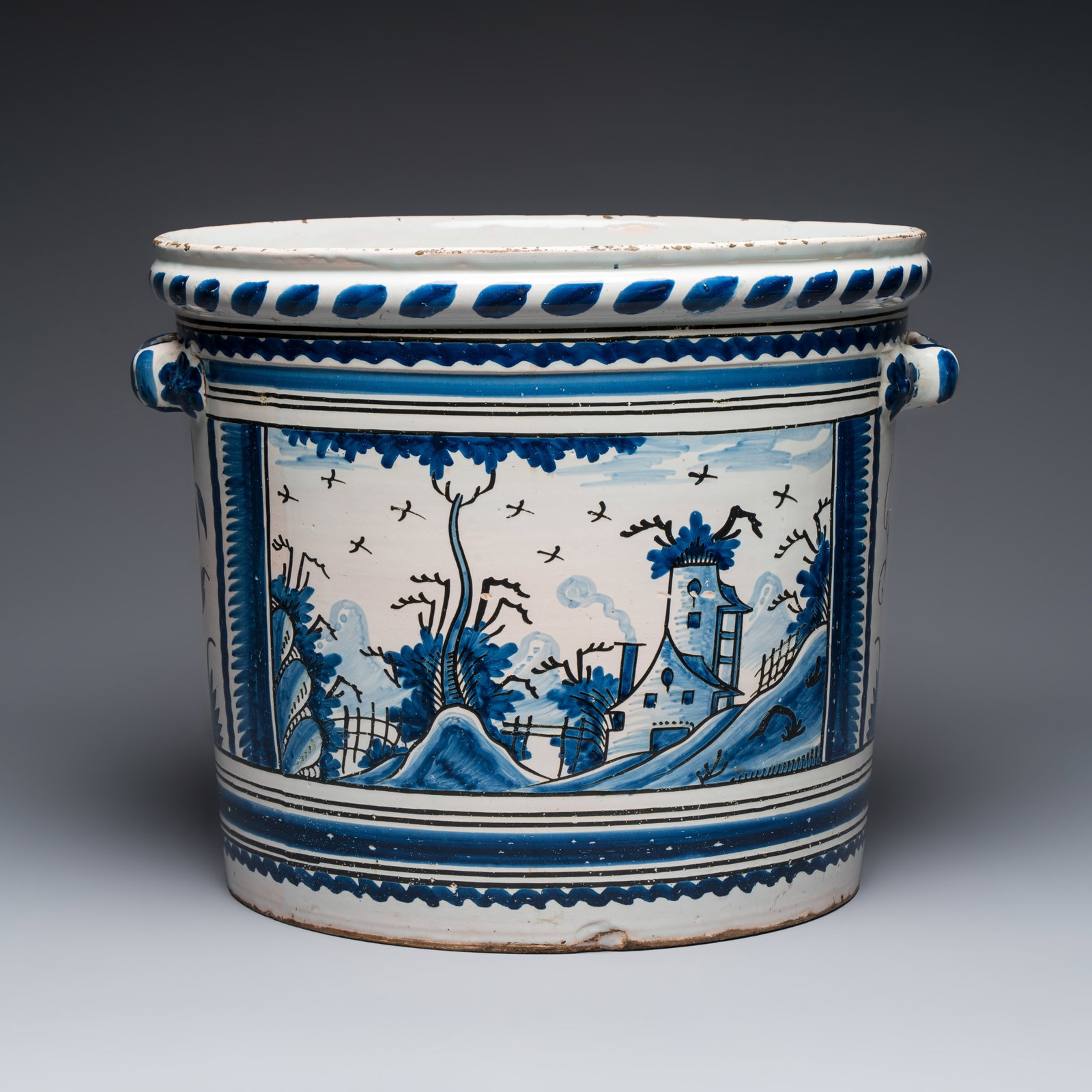 A large French blue and white 'Orange Tree' jardiniere, Nevers, 18th C.: A large French blue and white 'Orange Tree' jardiniere, Nevers, 18th C. L.: 48 cm - H.: 39 cm