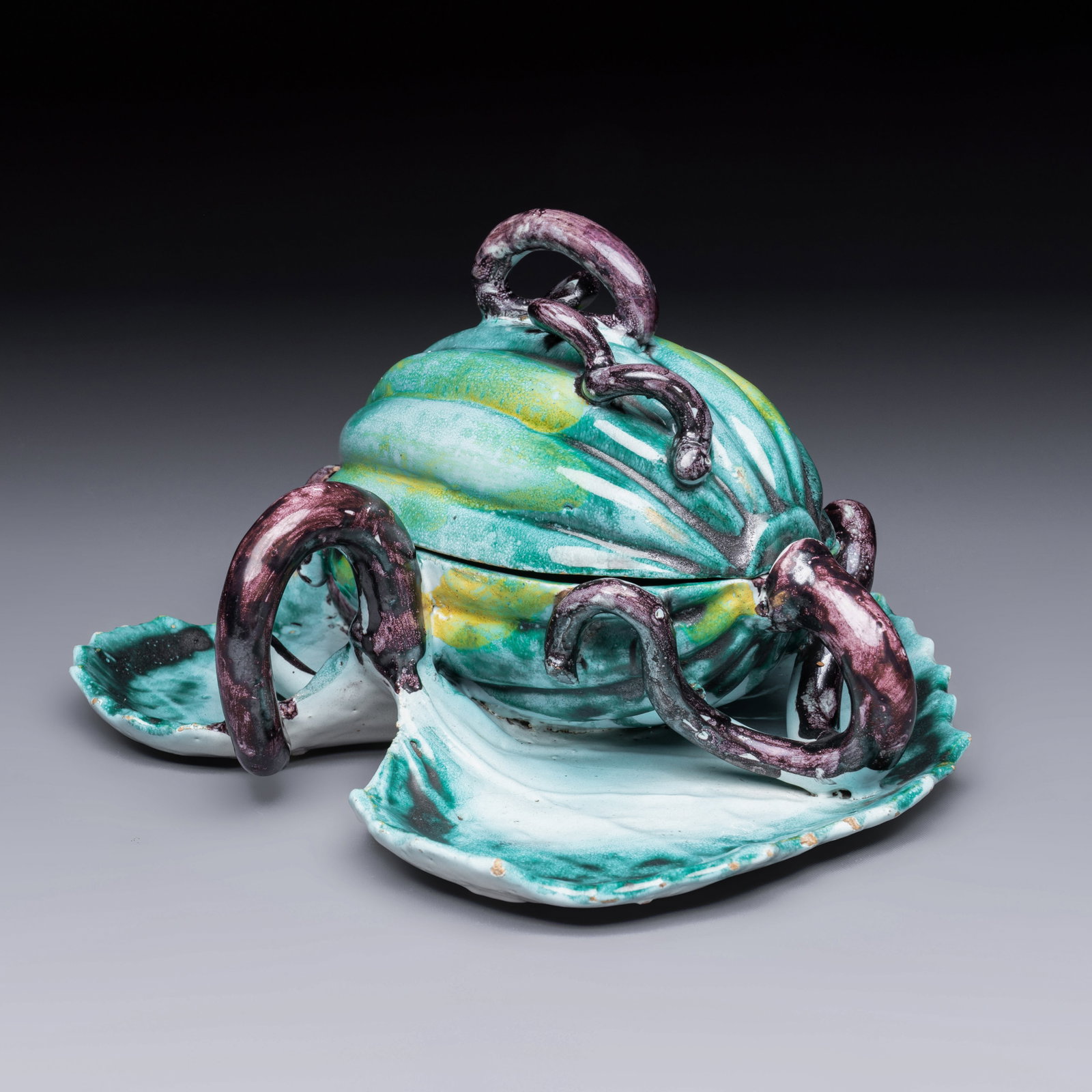 An unusual Brussels faience melon-shaped tureen and cover on a leaf-form stand, 18th C. (1 of 10)