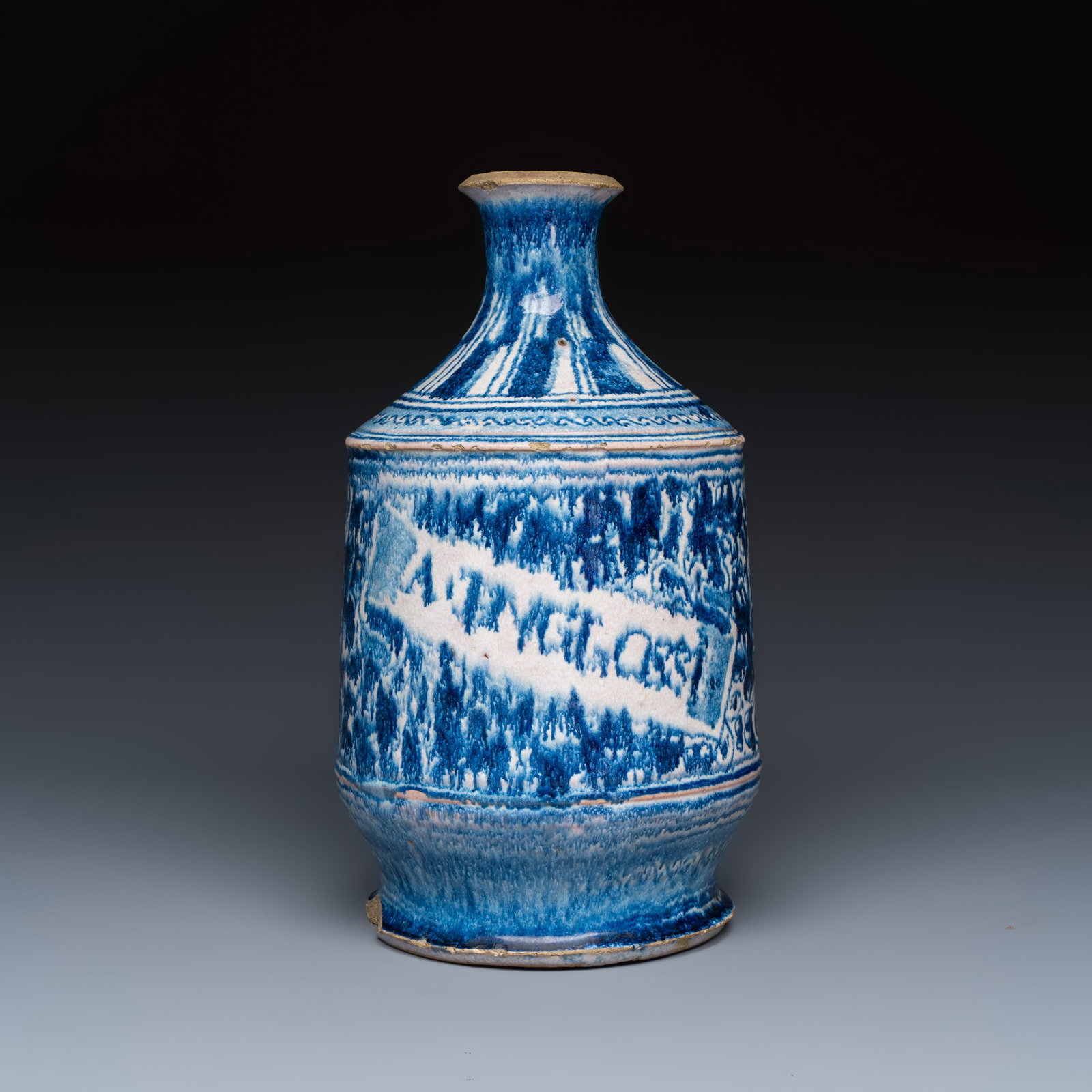 A blue and white Antwerp maiolica 'a foglie' pharmacy bottle, 16th C.: A blue and white Antwerp maiolica 'a foglie' pharmacy bottle, 16th C. H.: 27,4 cm Provenance: A Dutch private collection.