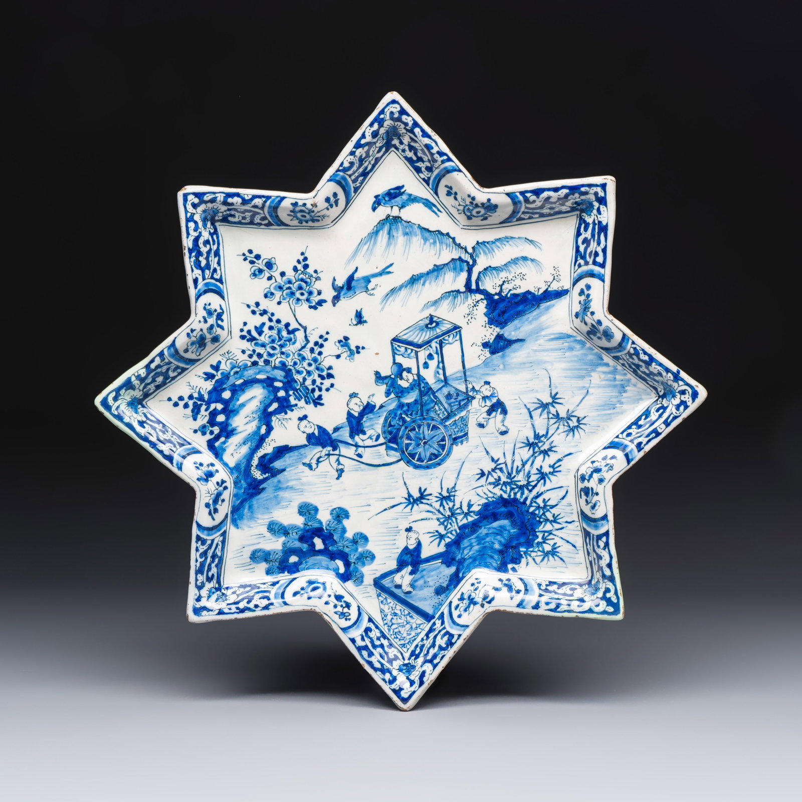 A blue and white Dutch Delft chinoiserie star-shaped dish, 18th C. (1 of 2)