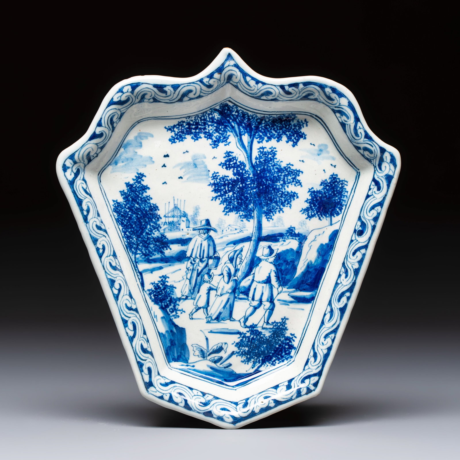 A fine blue and white Dutch Delft leaf-shaped condiment dish with travellers in a landscape, early (1 of 2)