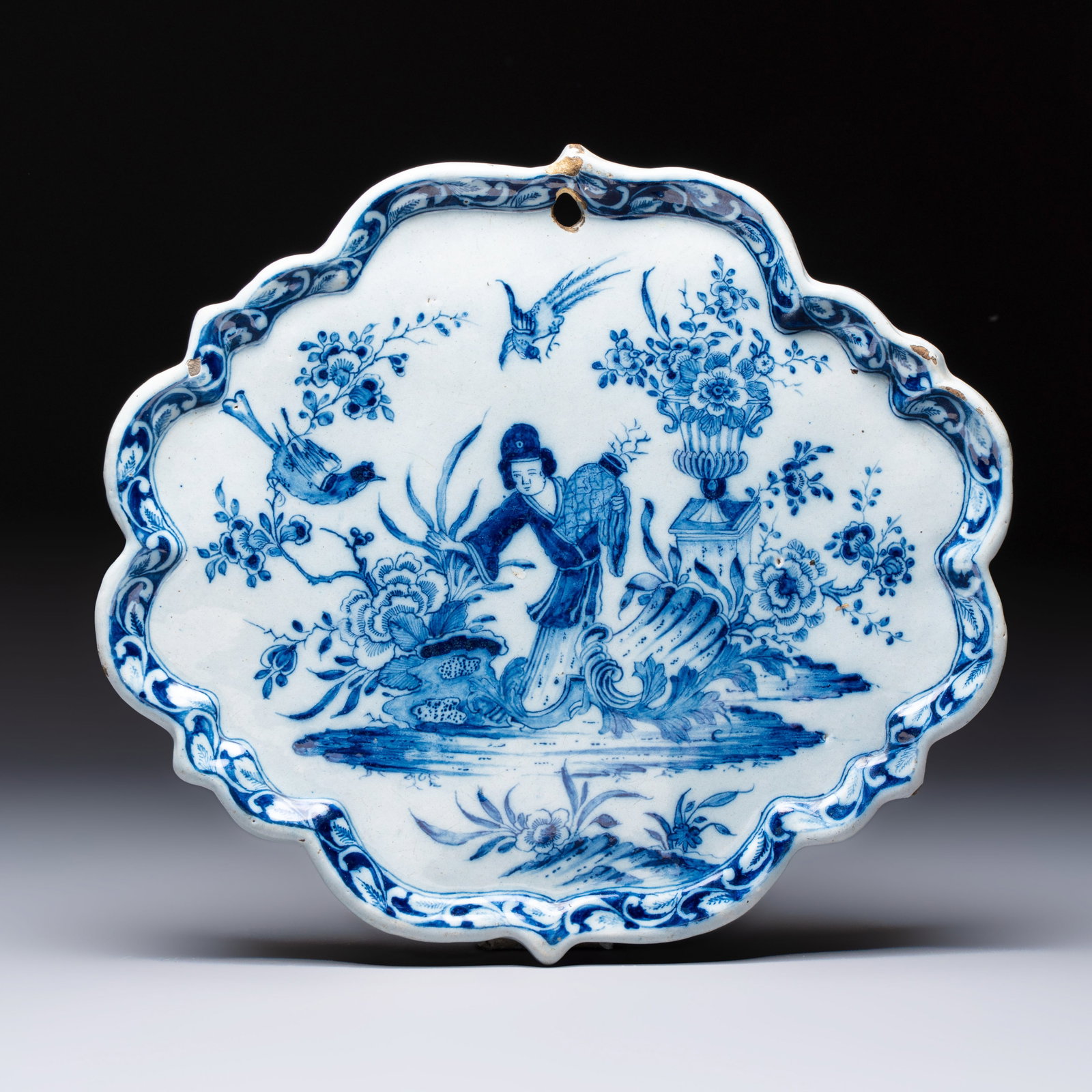 A blue and white Dutch Delft 'Chinoiserie' plaque with an elegant lady, 18th C. (1 of 2)