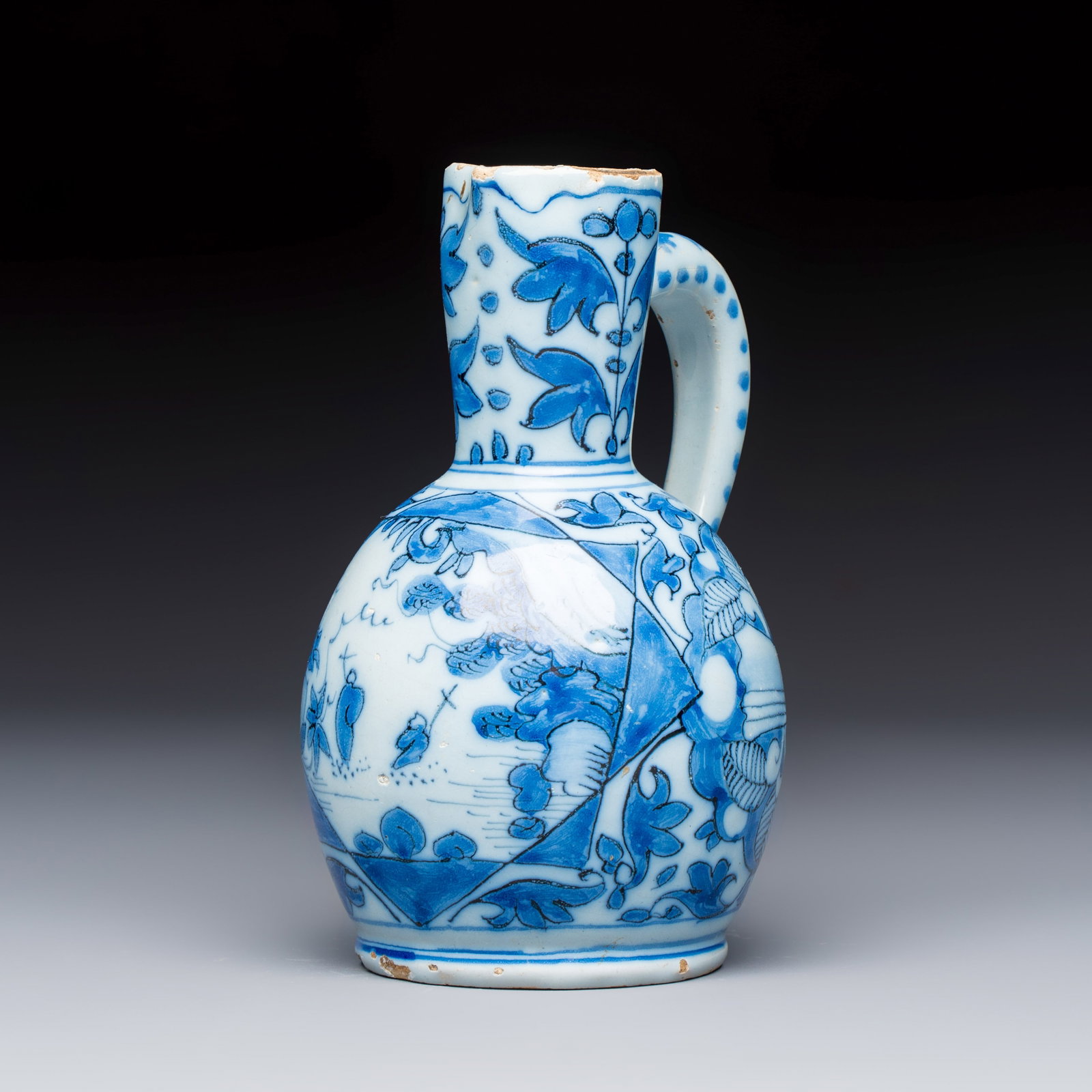 A small blue and white Dutch Delft chinoiserie ewer with figural and floral design, 17th C.: A small blue and white Dutch Delft chinoiserie ewer with figural and floral design, 17th C. H.: 17 cm