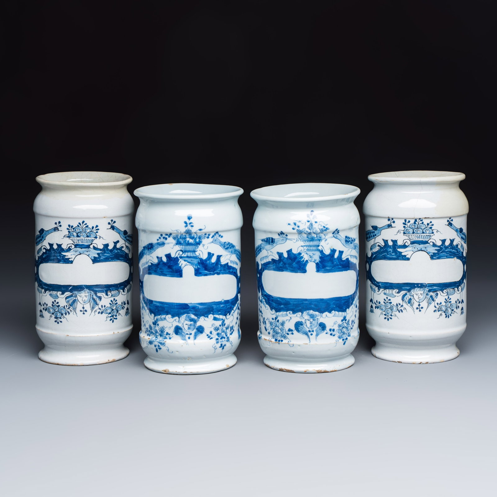 Four blue and white Dutch Delft albarello-type apothecary jars, 18th C.: Four blue and white Dutch Delft albarello-type apothecary jars, 18th C. H.: 18 cm | the tallest H.: 17,1 cm | the smallest Provenance: Van Nie and Winnubst Antiquairs, Amsterdam, with their label to t