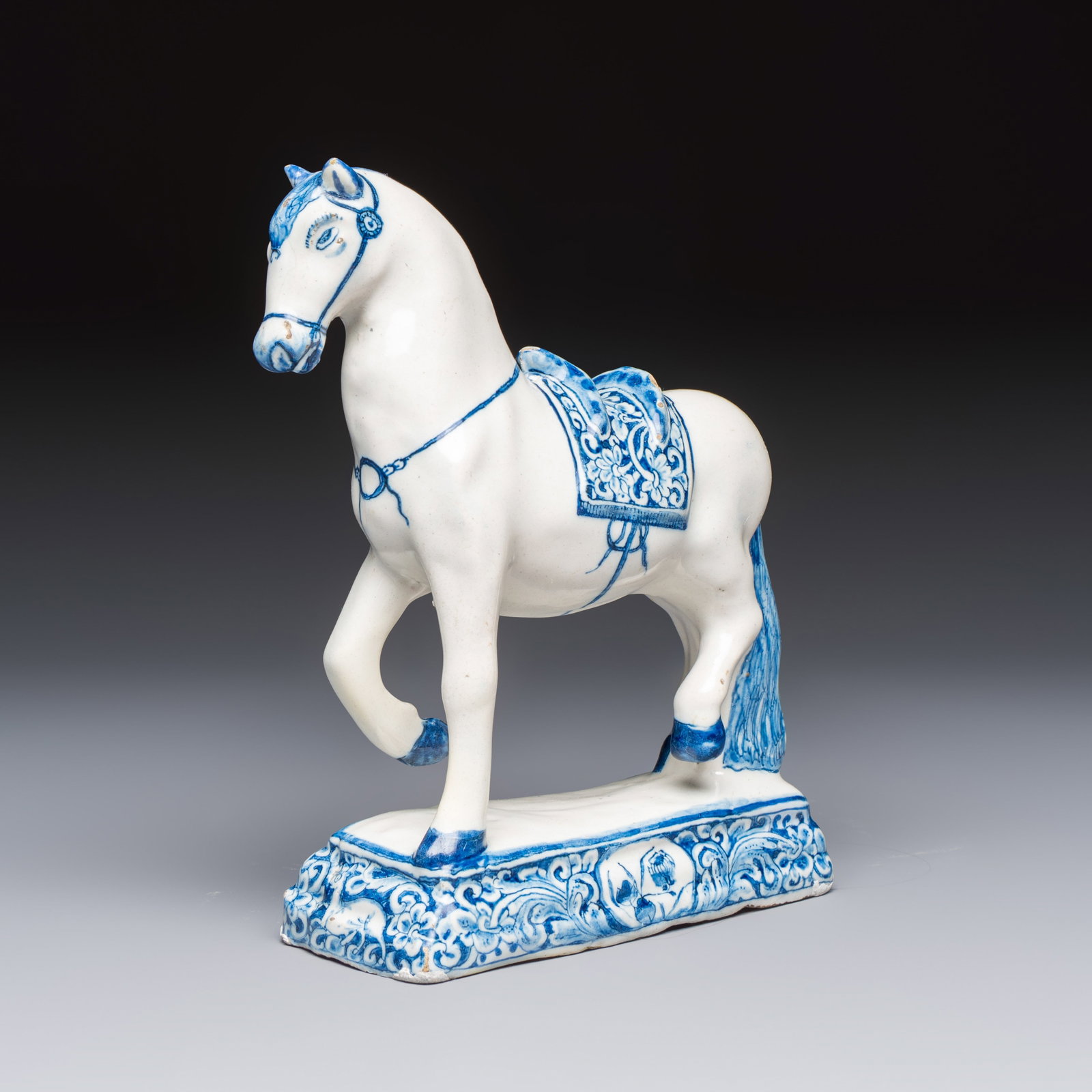A blue and white Dutch Delft model of a standing horse, 18th C.: A blue and white Dutch Delft model of a standing horse, 18th C. Dim: 13,8 x 6 x 17,8 cm