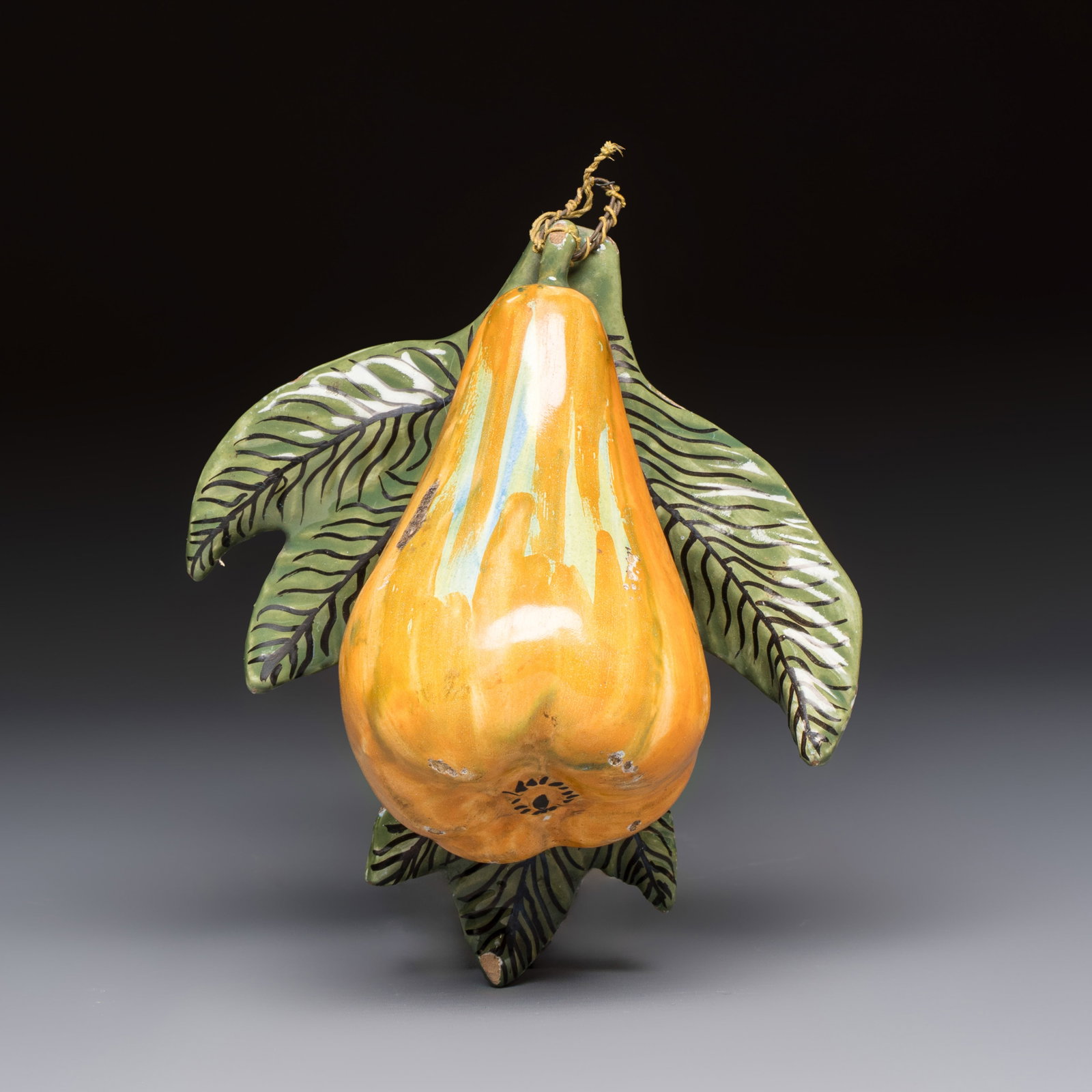 A polychrome Dutch Delft model of a pear, 19th C.: A polychrome Dutch Delft model of a pear, 19th C. Dim: 14,9 x 13,3 x 6,8 cm Provenance: The Muller-Dietens Collection.