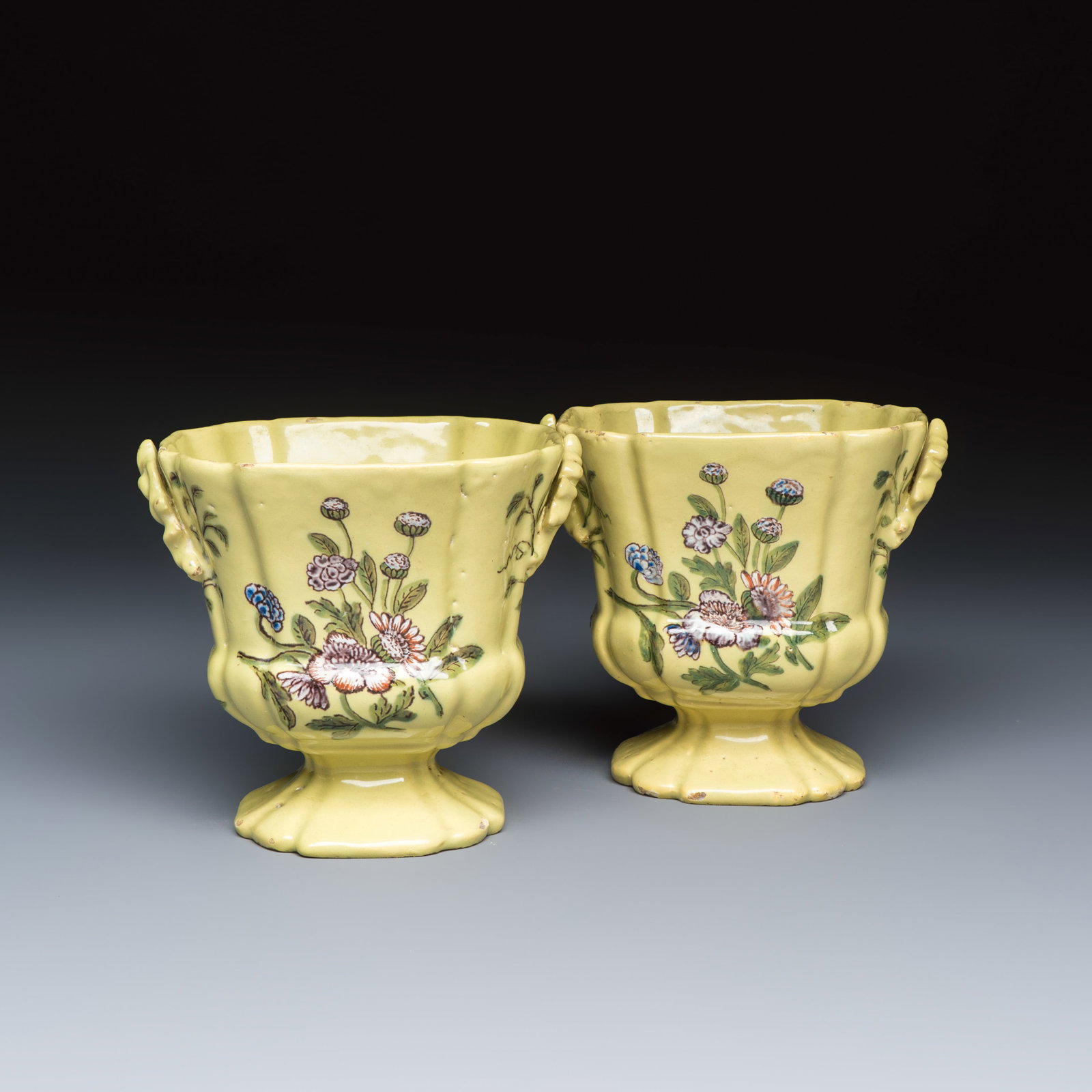 A pair of polychrome yellow-ground Dutch Delft jardinieres with floral design, 18th C.: A pair of polychrome yellow-ground Dutch Delft jardinieres with floral design, 18th C. Dim: 12,6 x 10,3 x 11,3 cm Provenance: Both with a label of Lucien Delplace. Marked AP for Anthony Pennis, the 'D