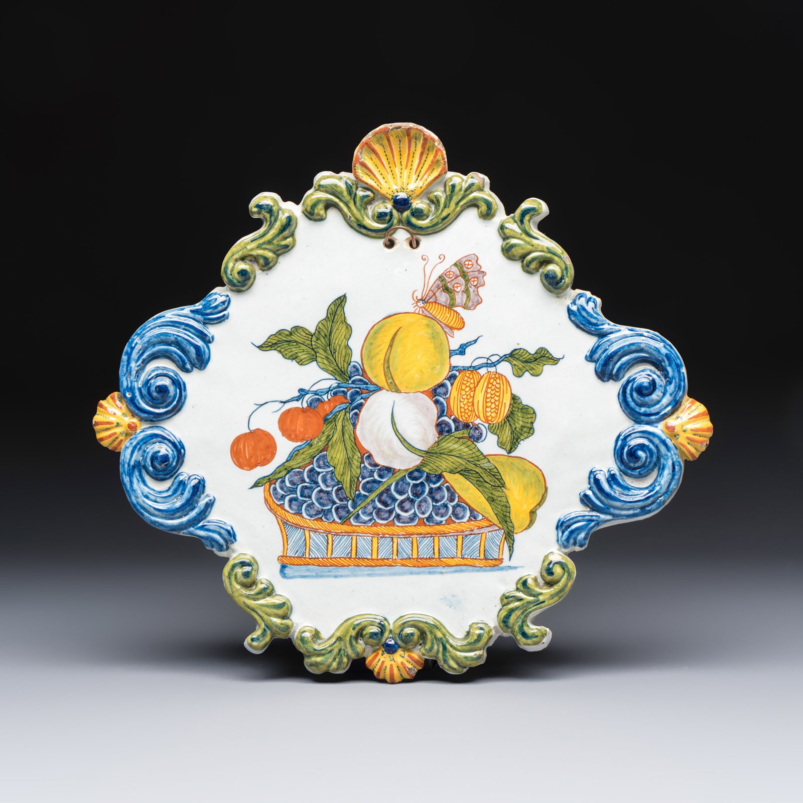 A polychrome Dutch Delft 'Fruit Basket' plaque, 18th C.: A polychrome Dutch Delft 'Fruit Basket' plaque, 18th C. Dim: 34 x 30,5 cm